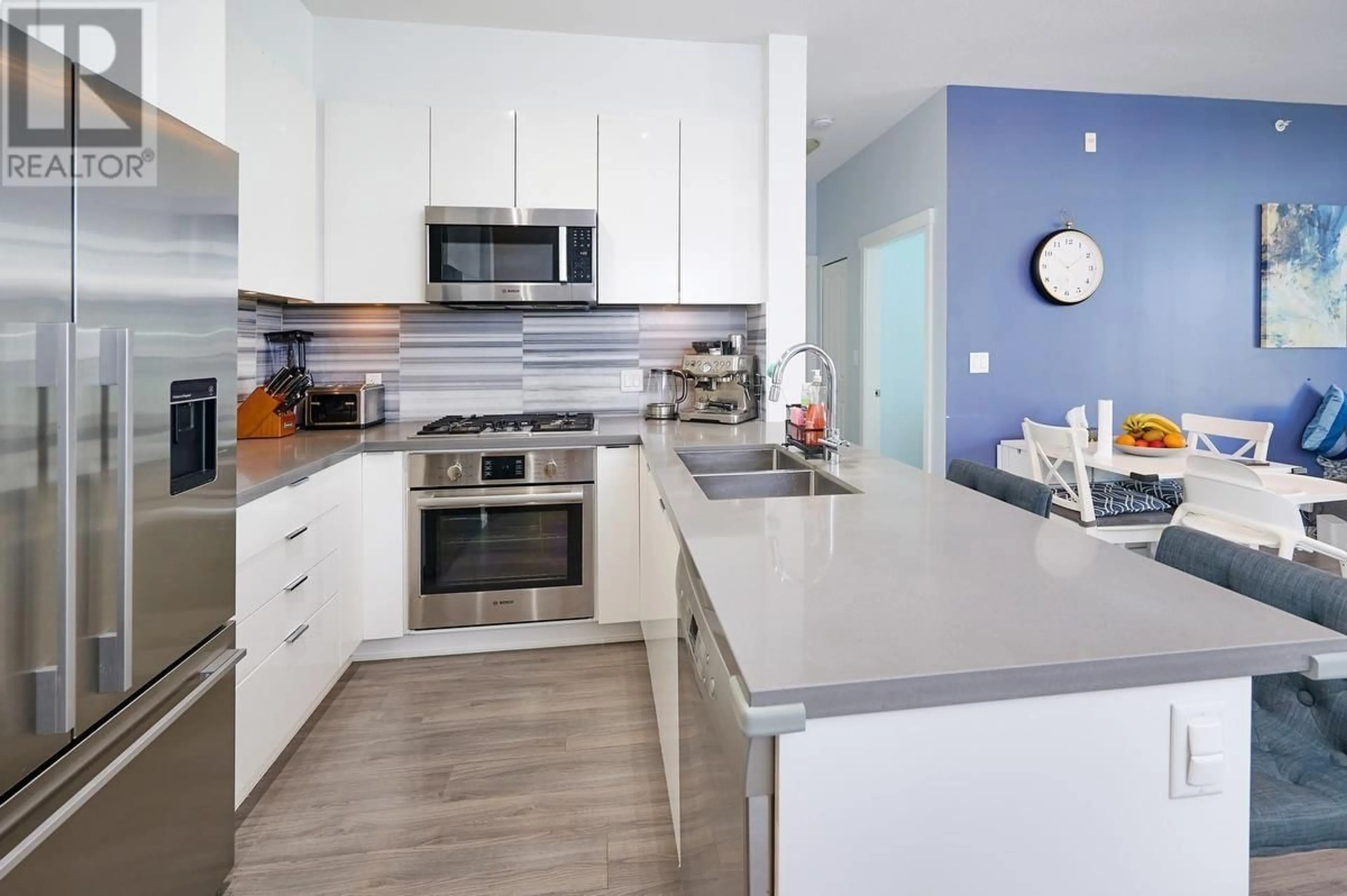Open concept kitchen, ceramic/tile floor for 503 - 3168 RIVERWALK AVENUE, Vancouver British Columbia V5S0B8