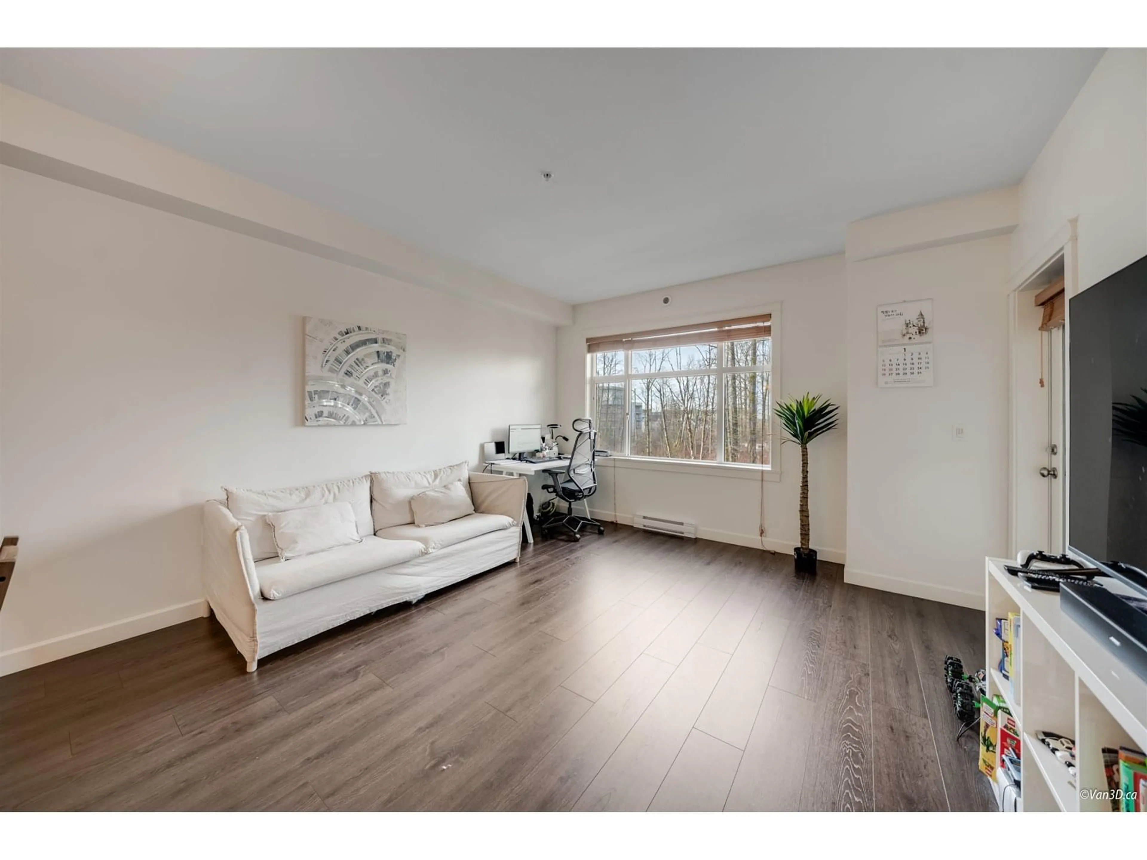 Living room with furniture, wood/laminate floor for 303 - 8526 202B, Langley British Columbia V2Y3L3