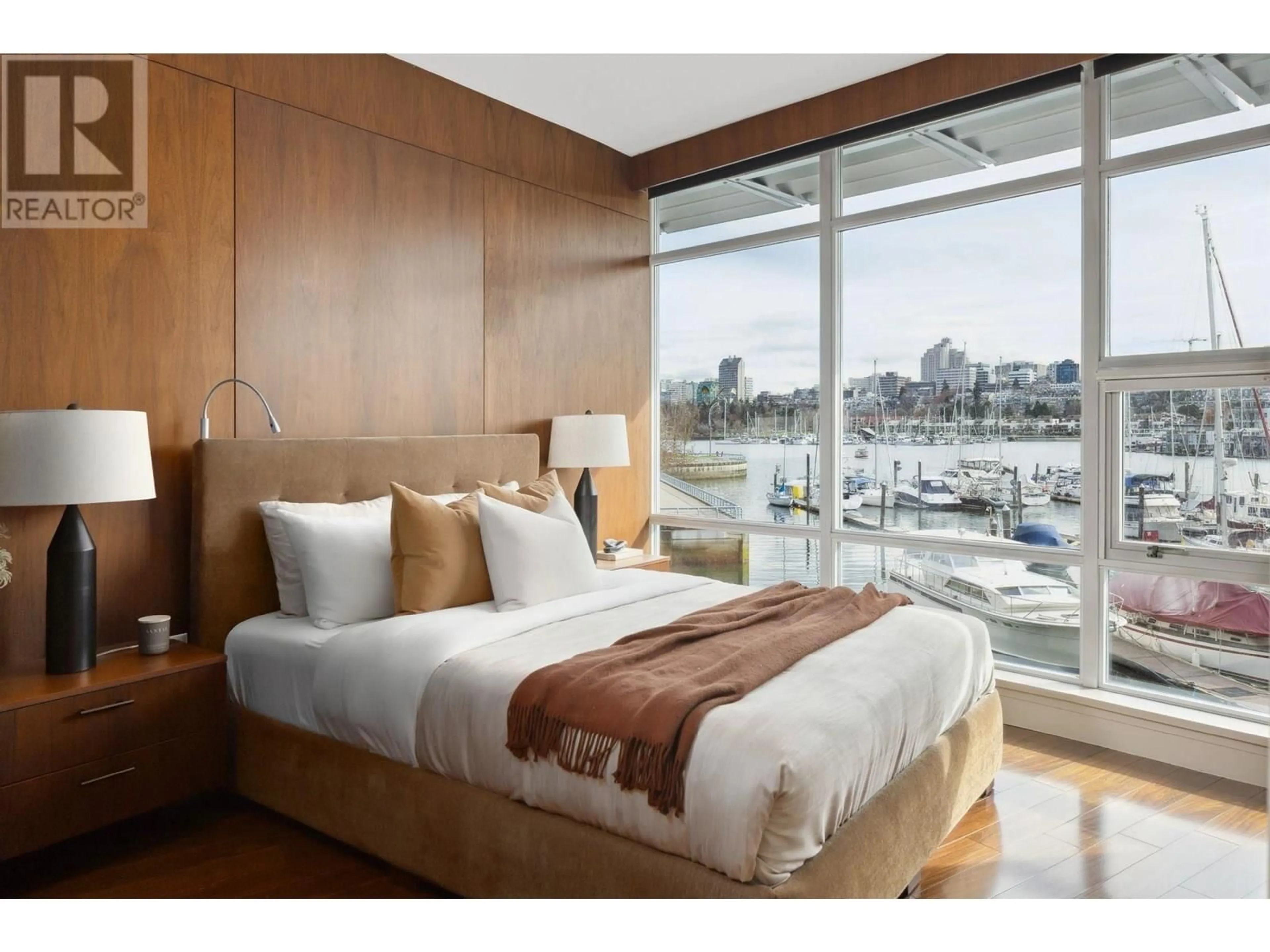 Bedroom with bed, wood/laminate floor for 202 - 628 KINGHORNE MEWS, Vancouver British Columbia V6Z3H6