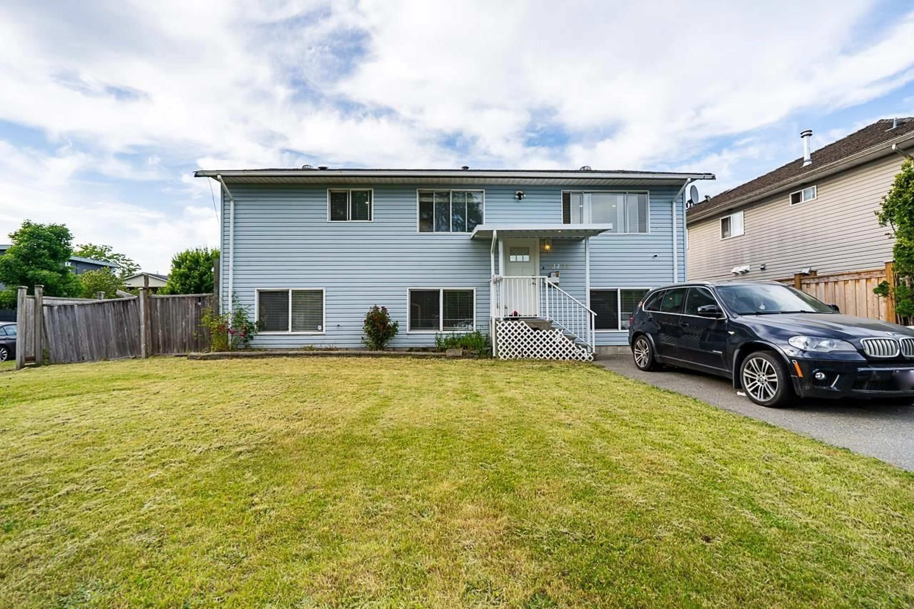 Home with vinyl exterior material, street for 13421 87A, Surrey British Columbia V3W6B7
