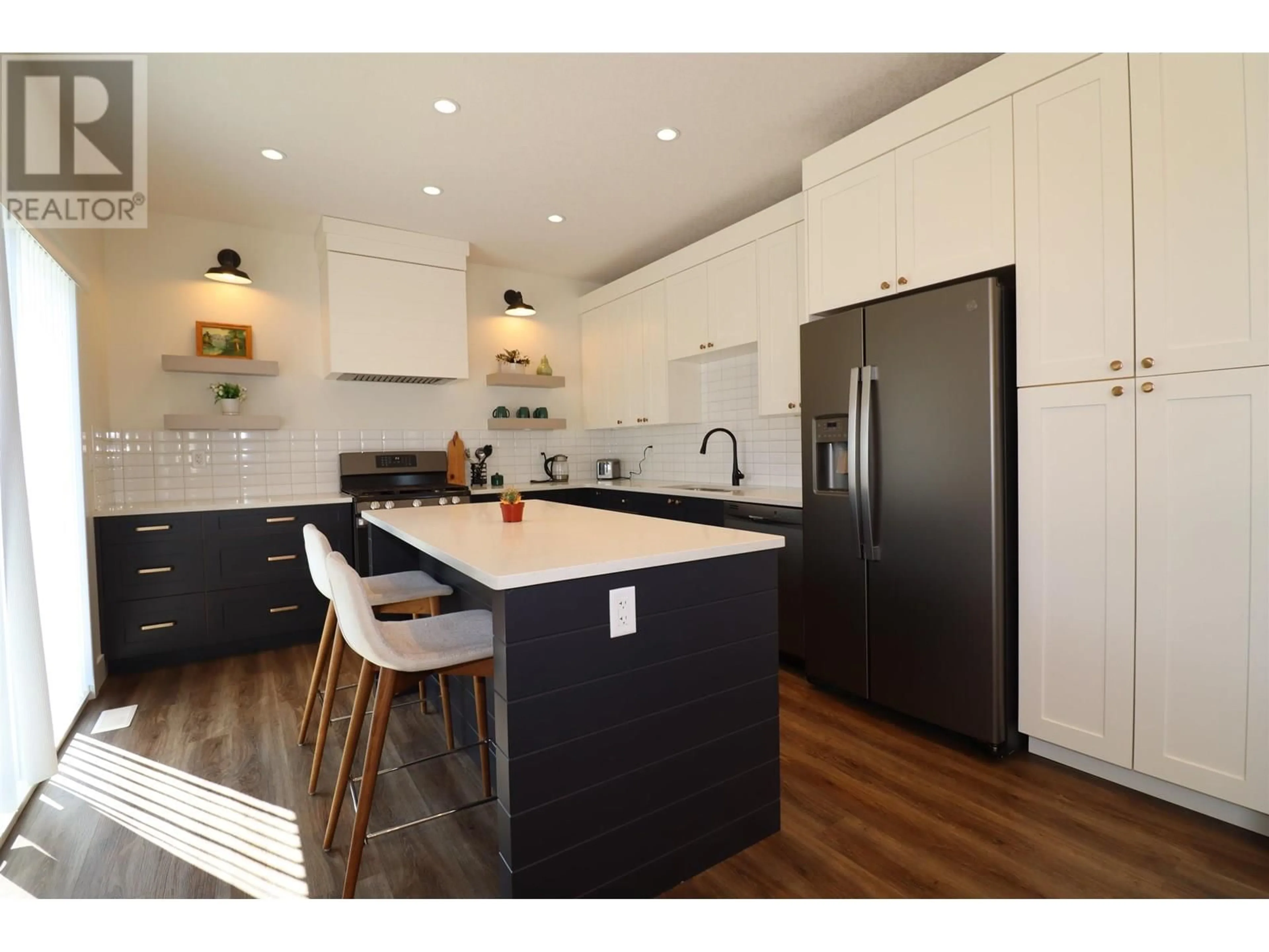 Open concept kitchen, wood/laminate floor for 201 - 4274 22ND AVENUE, Prince George British Columbia V2N0J4