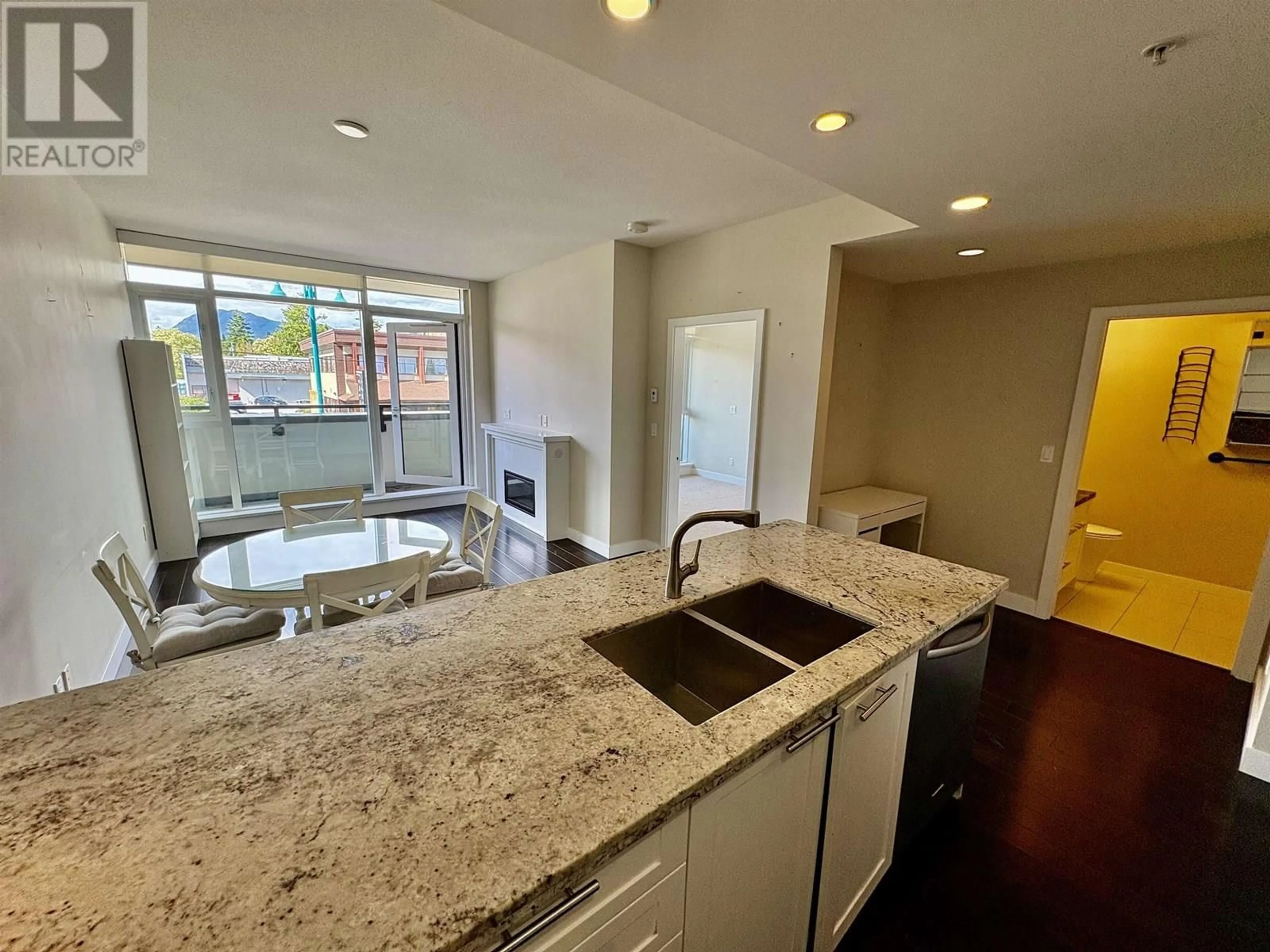 Open concept kitchen, ceramic/tile floor for 212 - 5665 TEREDO STREET, Sechelt British Columbia V7Z0J2