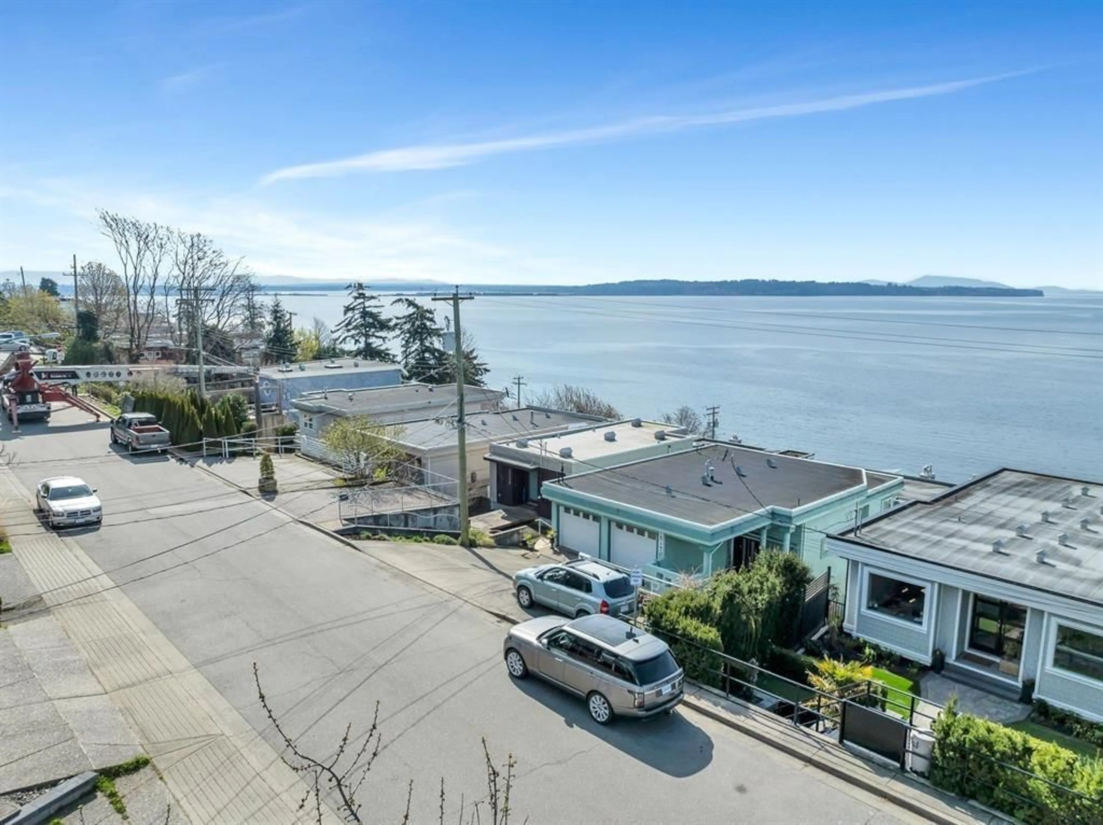 A pic from outside/outdoor area/front of a property/back of a property/a pic from drone, water/lake/river/ocean view for 15161 VICTORIA, White Rock British Columbia V4B1G5