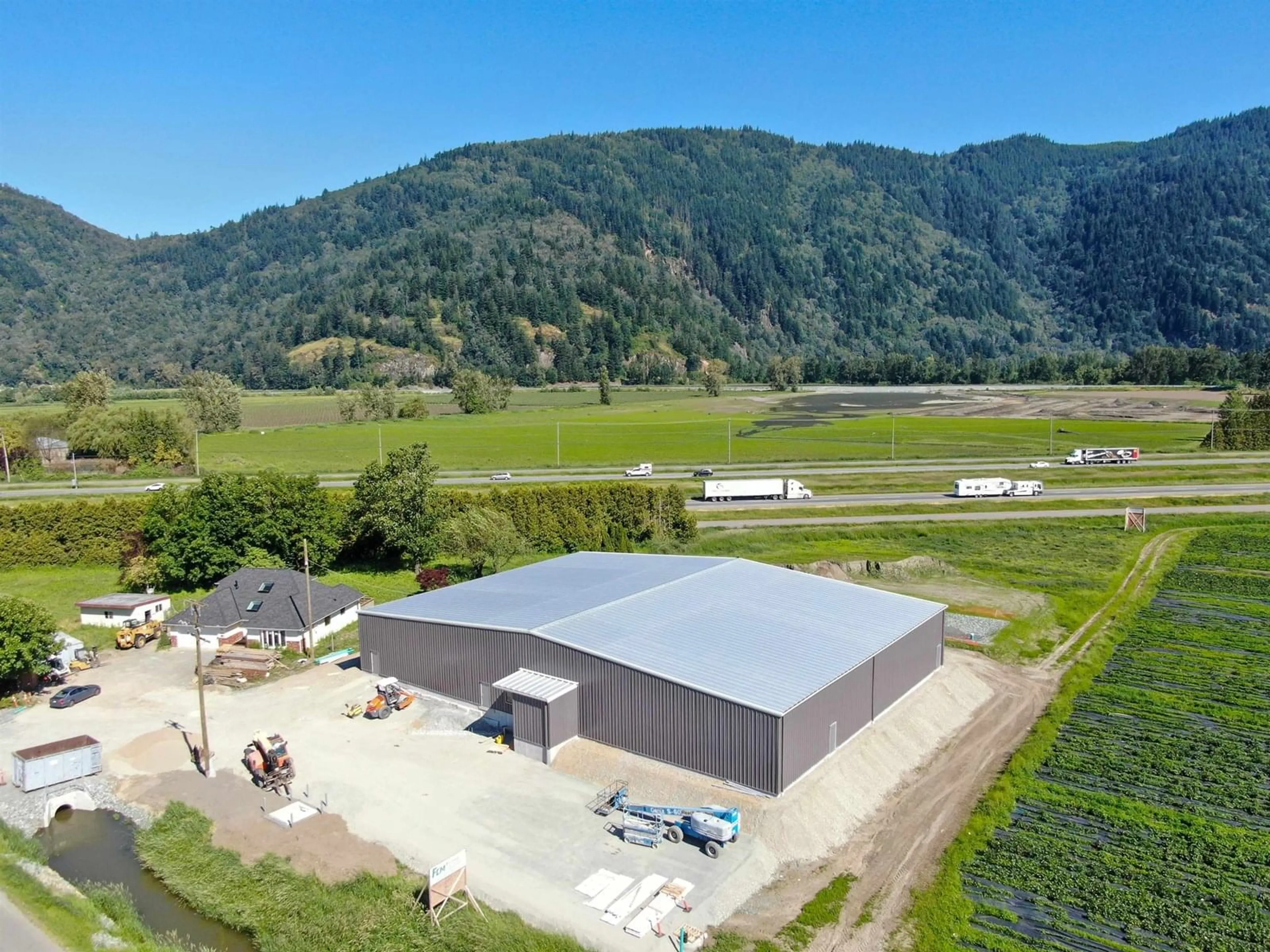 A pic from outside/outdoor area/front of a property/back of a property/a pic from drone, mountain view for 38989 NO. 4, Abbotsford British Columbia V3G2G2
