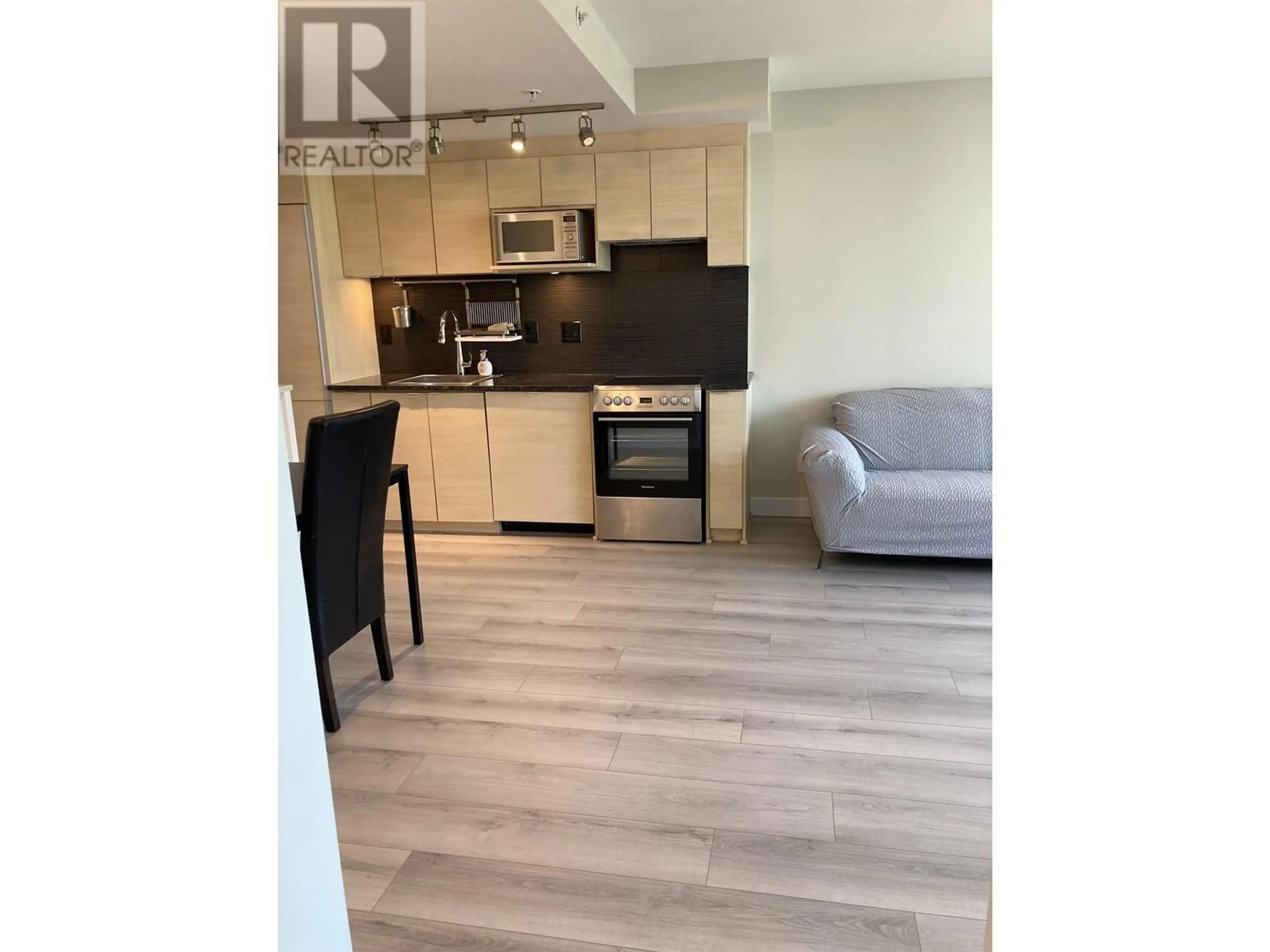 Open concept kitchen, wood/laminate floor for 704 - 488 MARINE DRIVE, Vancouver British Columbia V6X0C6