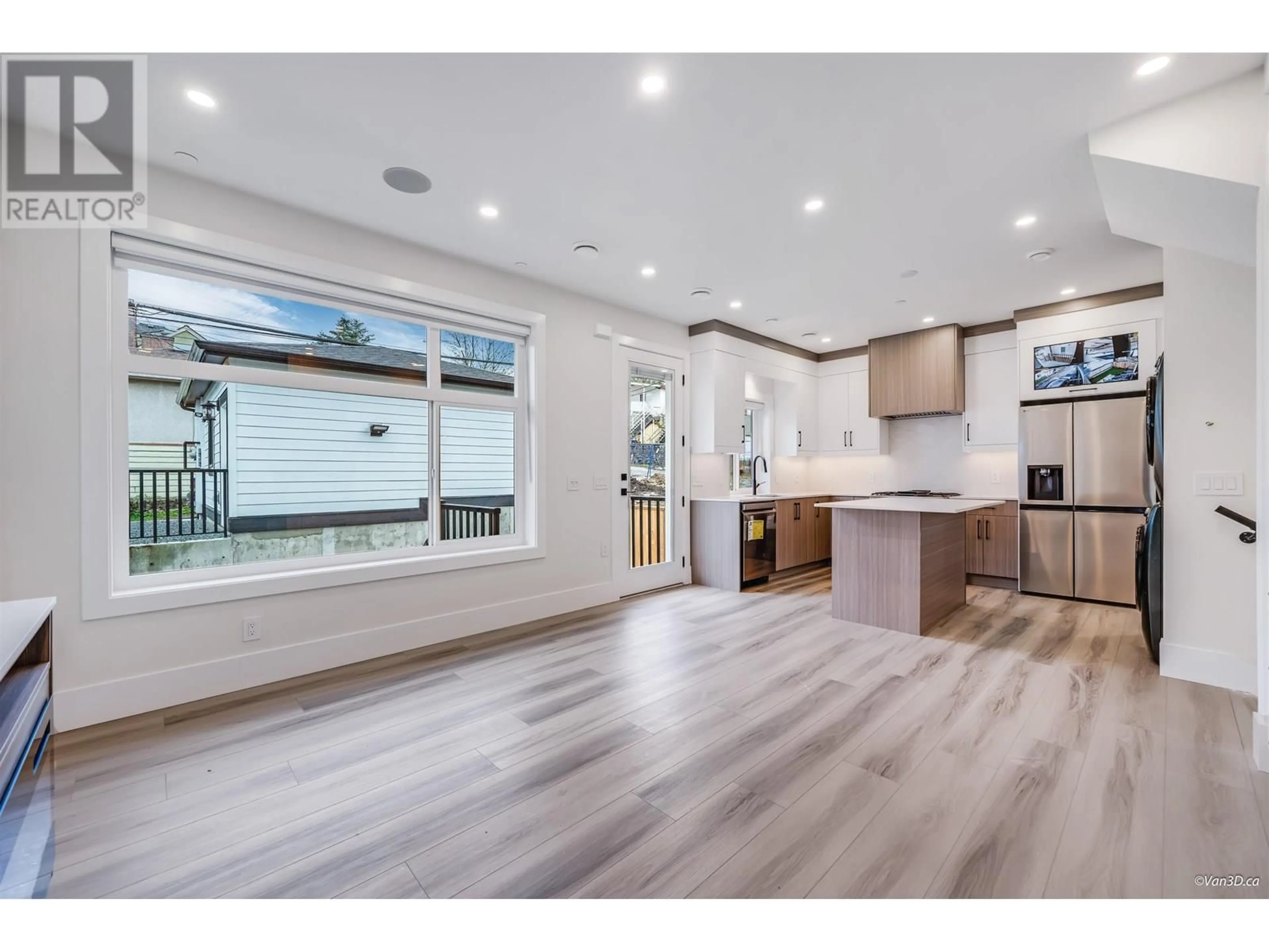 Open concept kitchen, wood/laminate floor for 4318 NANAIMO STREET, Vancouver British Columbia V5N5J1