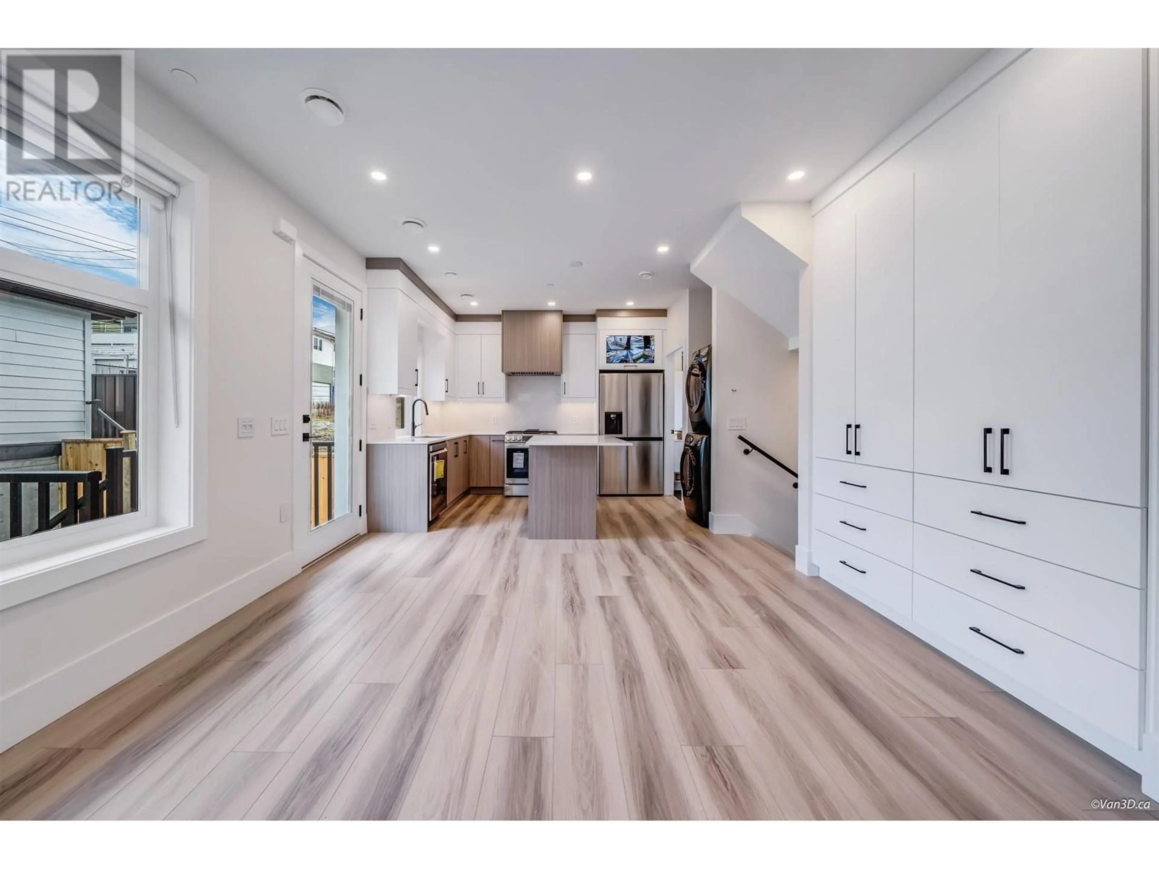 Open concept kitchen, wood/laminate floor for 4318 NANAIMO STREET, Vancouver British Columbia V5N5J1