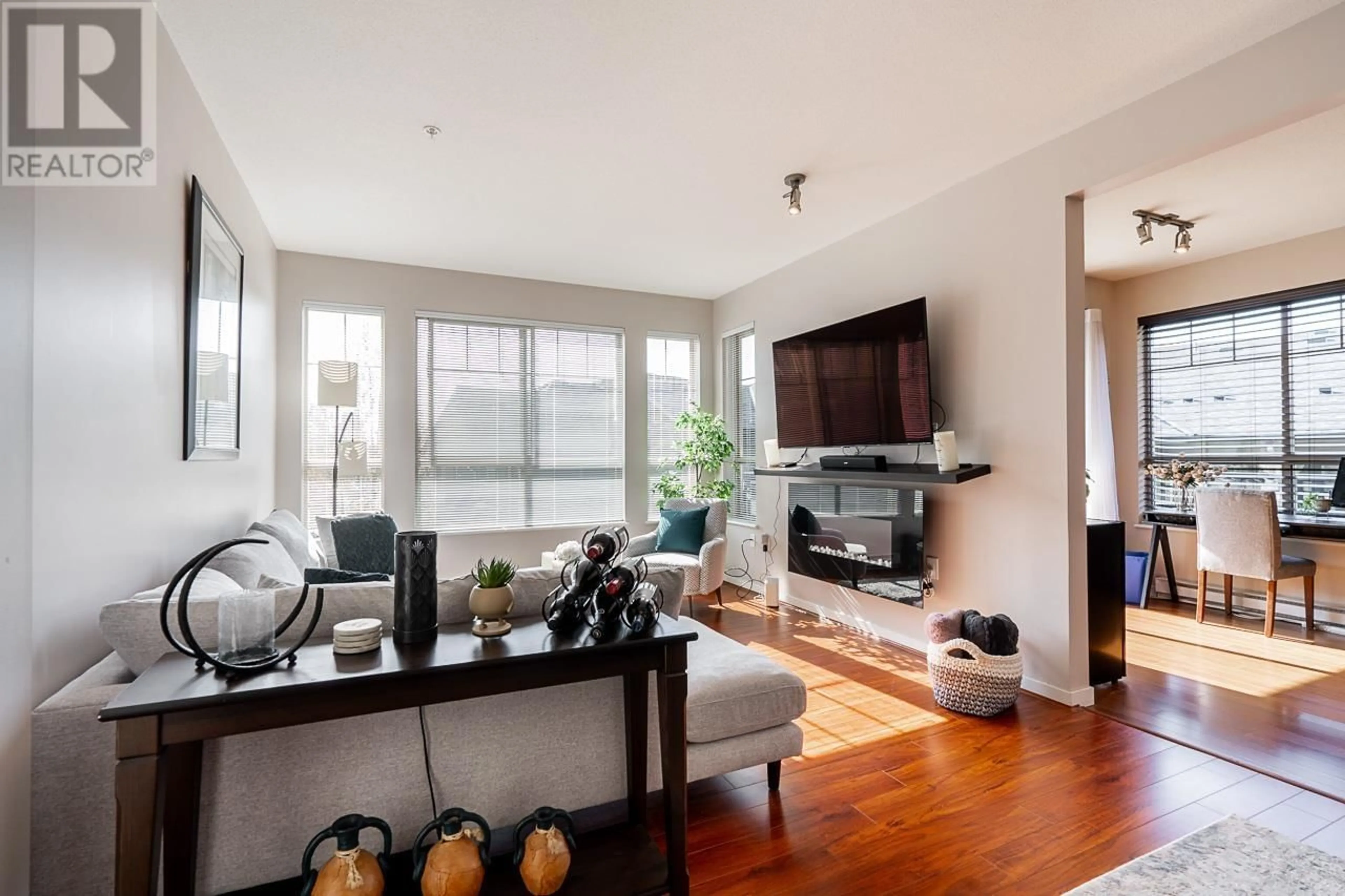 Living room with furniture, wood/laminate floor for 308 - 2969 WHISPER WAY, Coquitlam British Columbia V3E3S8