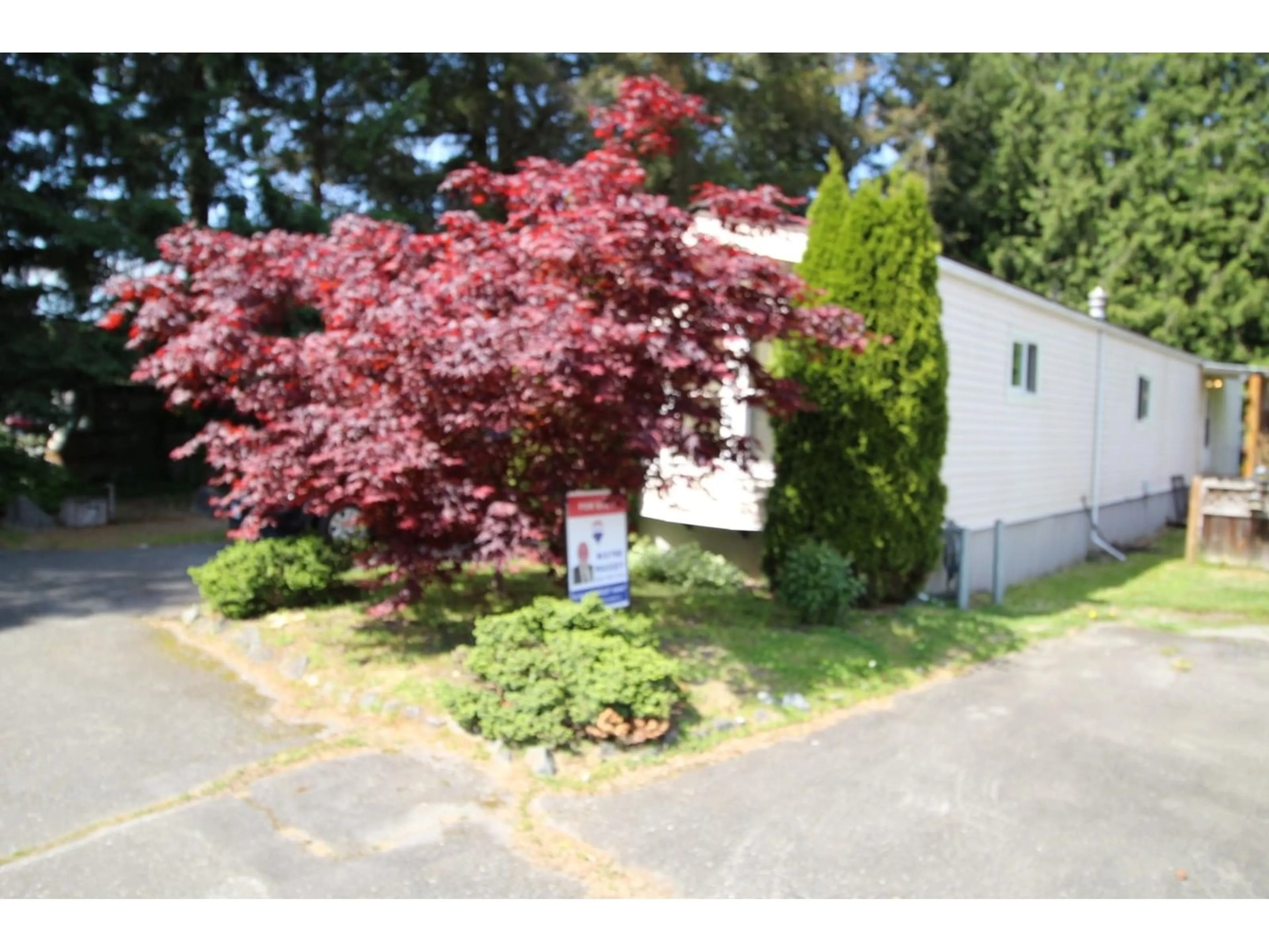 A pic from outside/outdoor area/front of a property/back of a property/a pic from drone, street for 207 - 45835 SLEEPY HOLLOW ROAD, Cultus Lake British Columbia V2R5A9