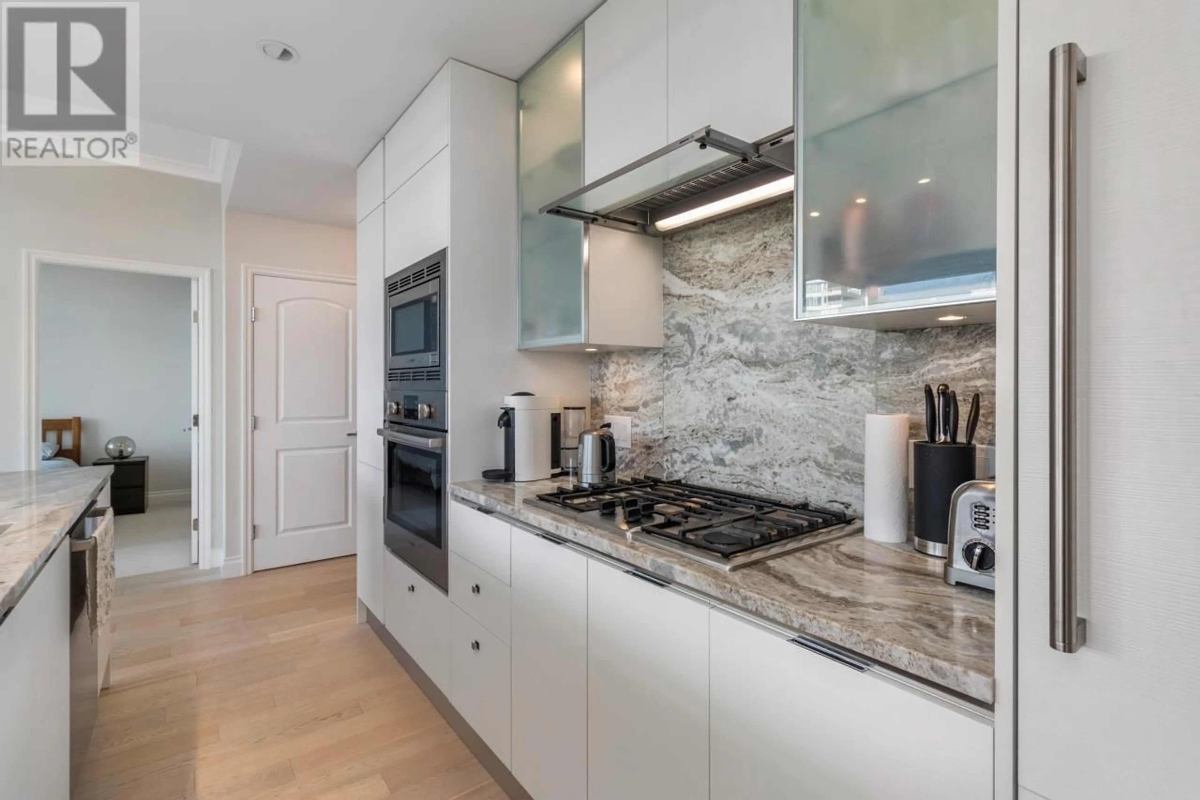 Contemporary kitchen, ceramic/tile floor for 506 - 175 VICTORY SHIP WAY, North Vancouver British Columbia V7L0G1