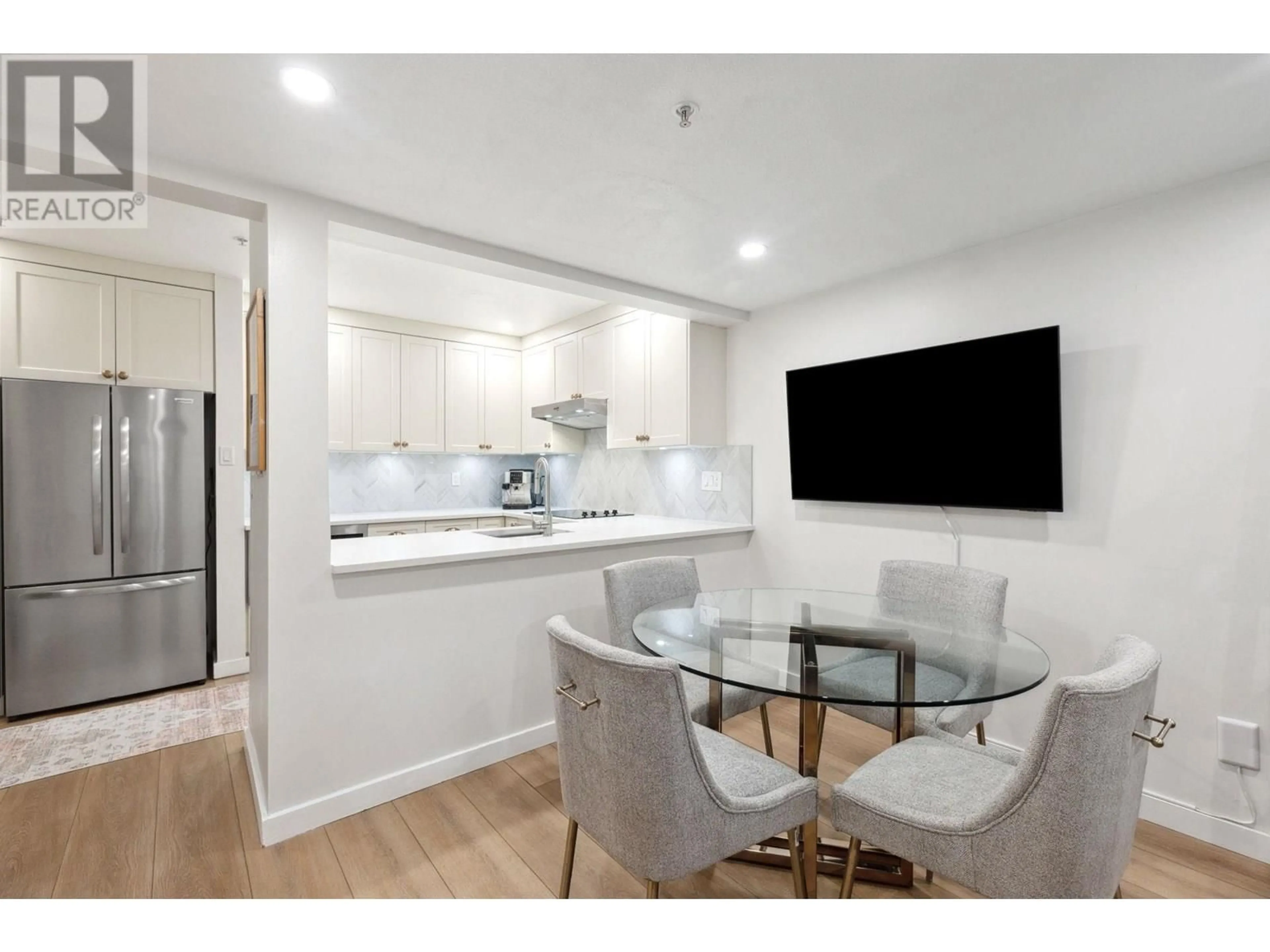 Open concept kitchen, wood/laminate floor for 16 - 2375 BROADWAY, Vancouver British Columbia V6K2E6