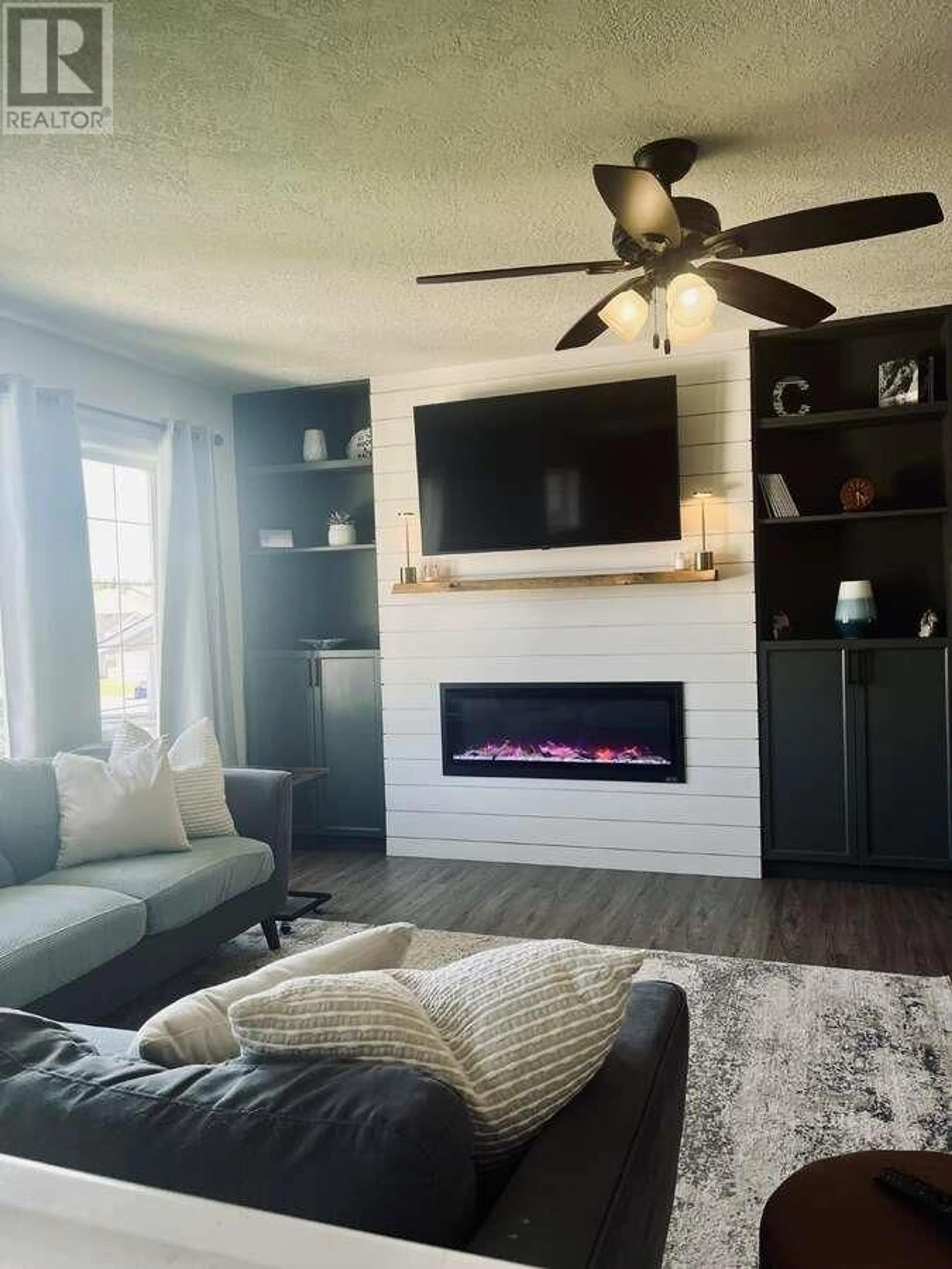 Living room with furniture, wood/laminate floor for 5423 WOODOAK CRESCENT, Prince George British Columbia V2K5A6
