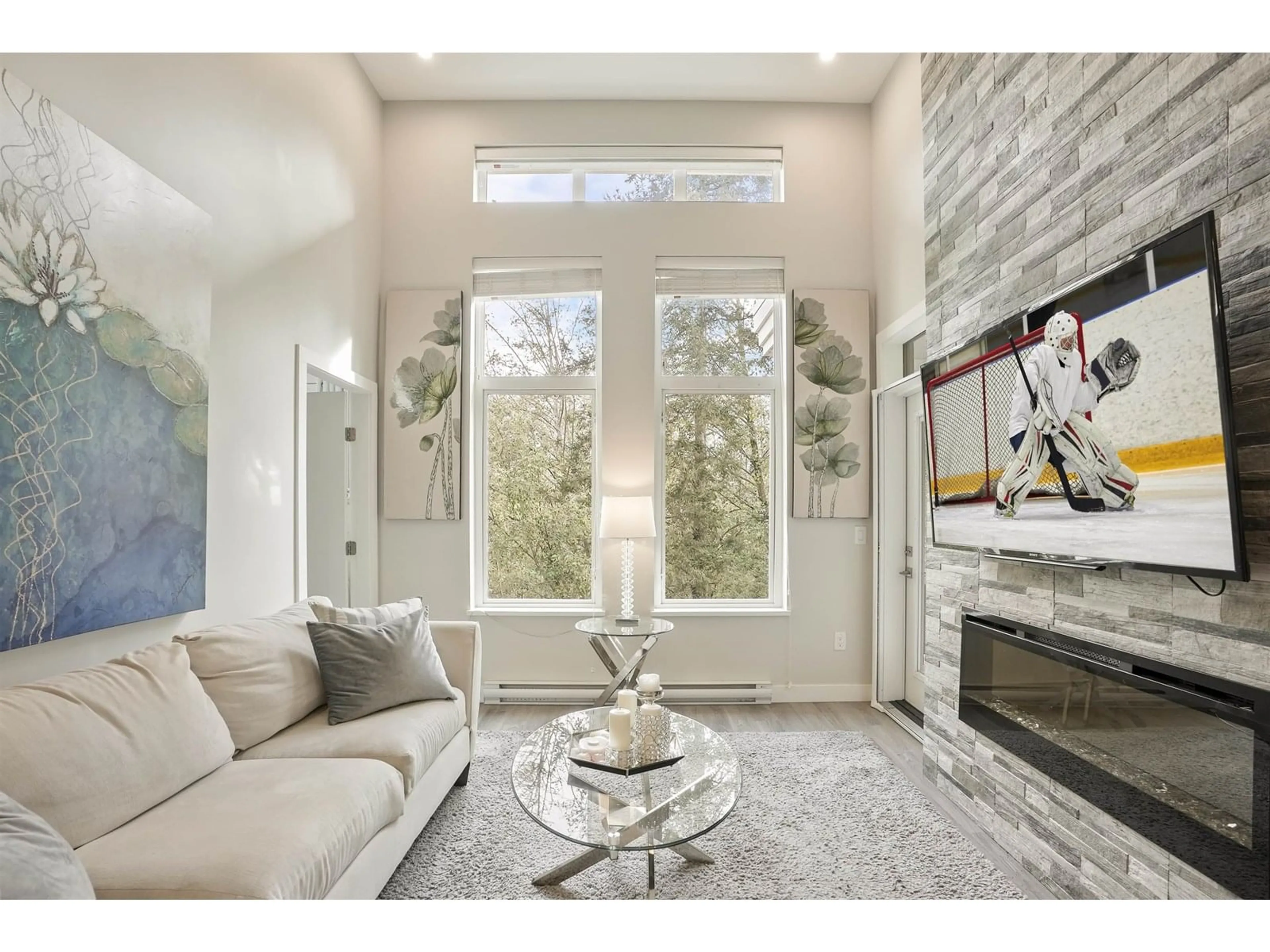 Living room with furniture, ceramic/tile floor for 405 - 15436 31, Surrey British Columbia V3Z1H3