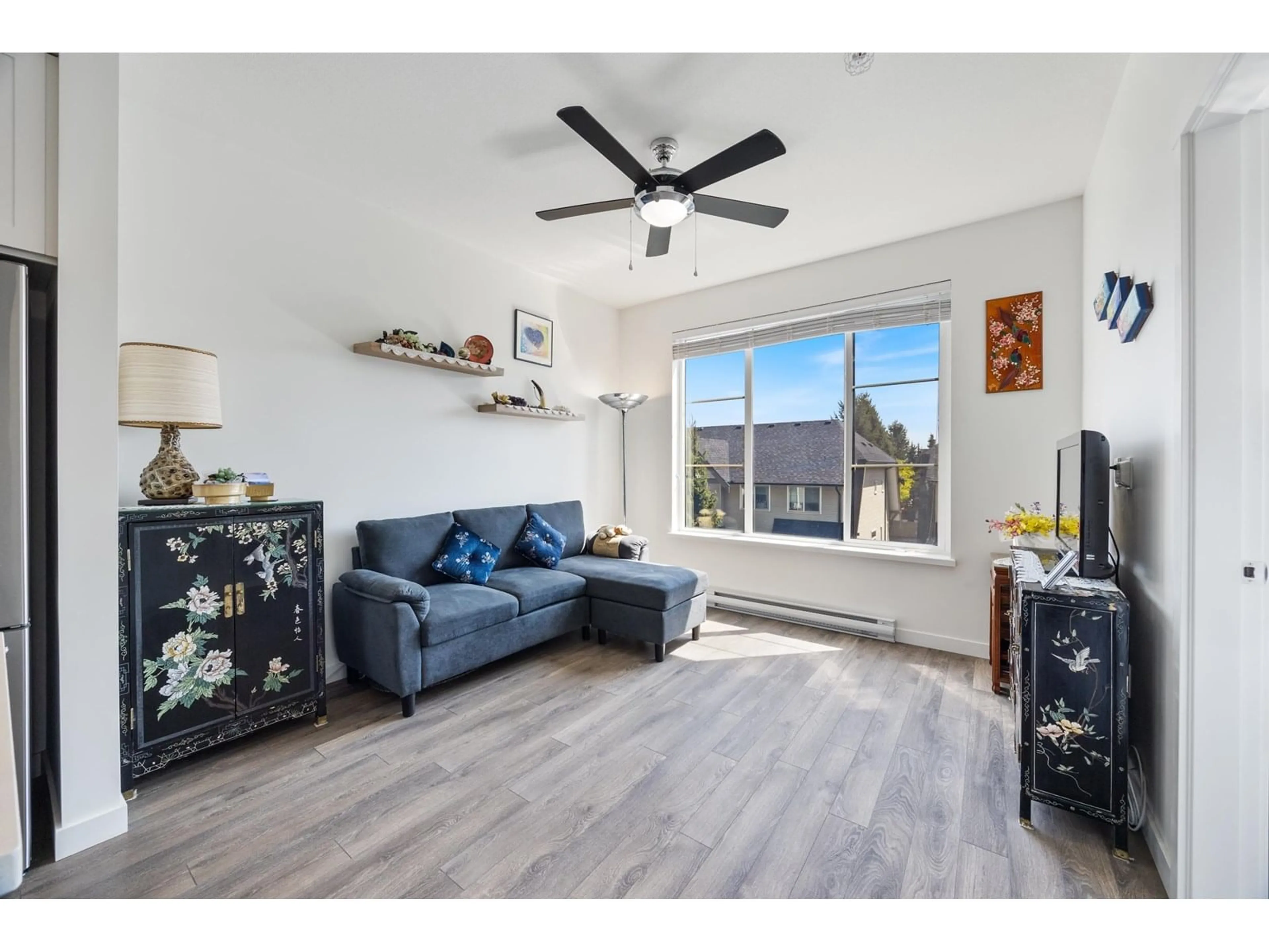 Living room with furniture, wood/laminate floor for 312 - 15835 85, Surrey British Columbia V4N6W6