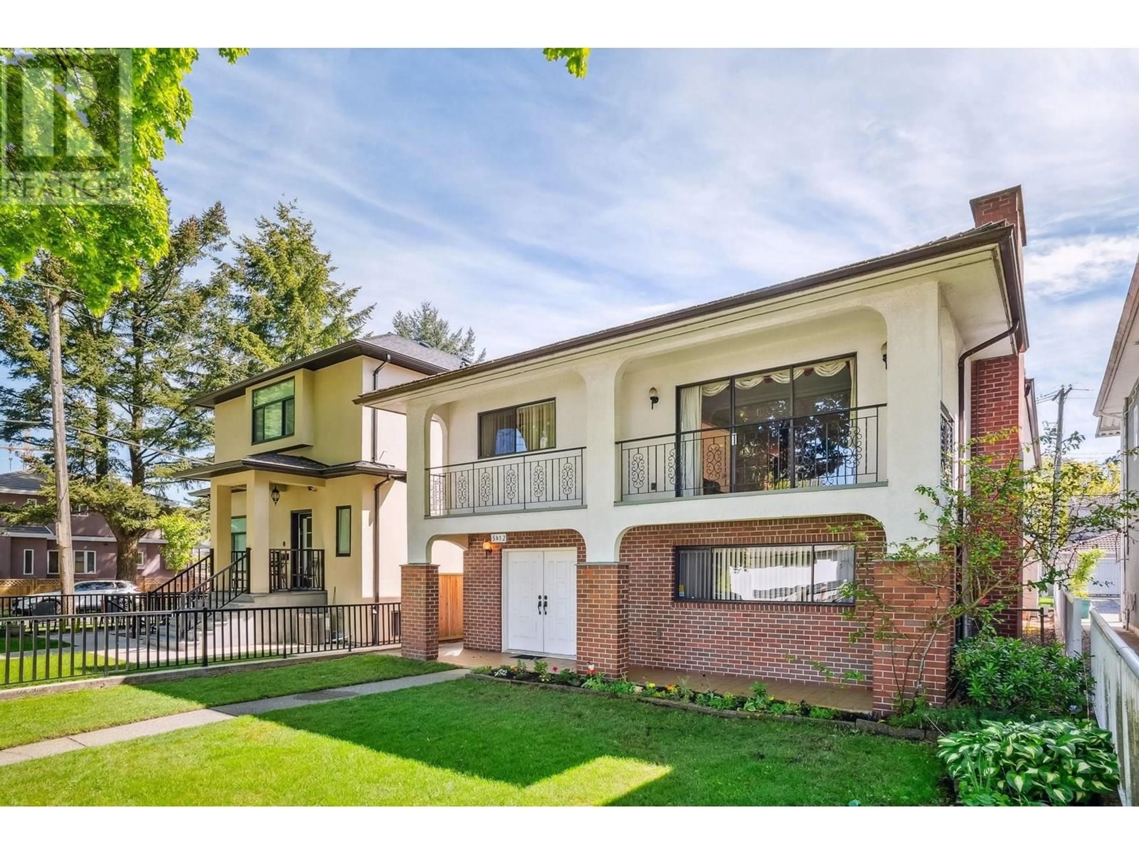 Home with brick exterior material, street for 5412 RHODES STREET, Vancouver British Columbia V5R3N9
