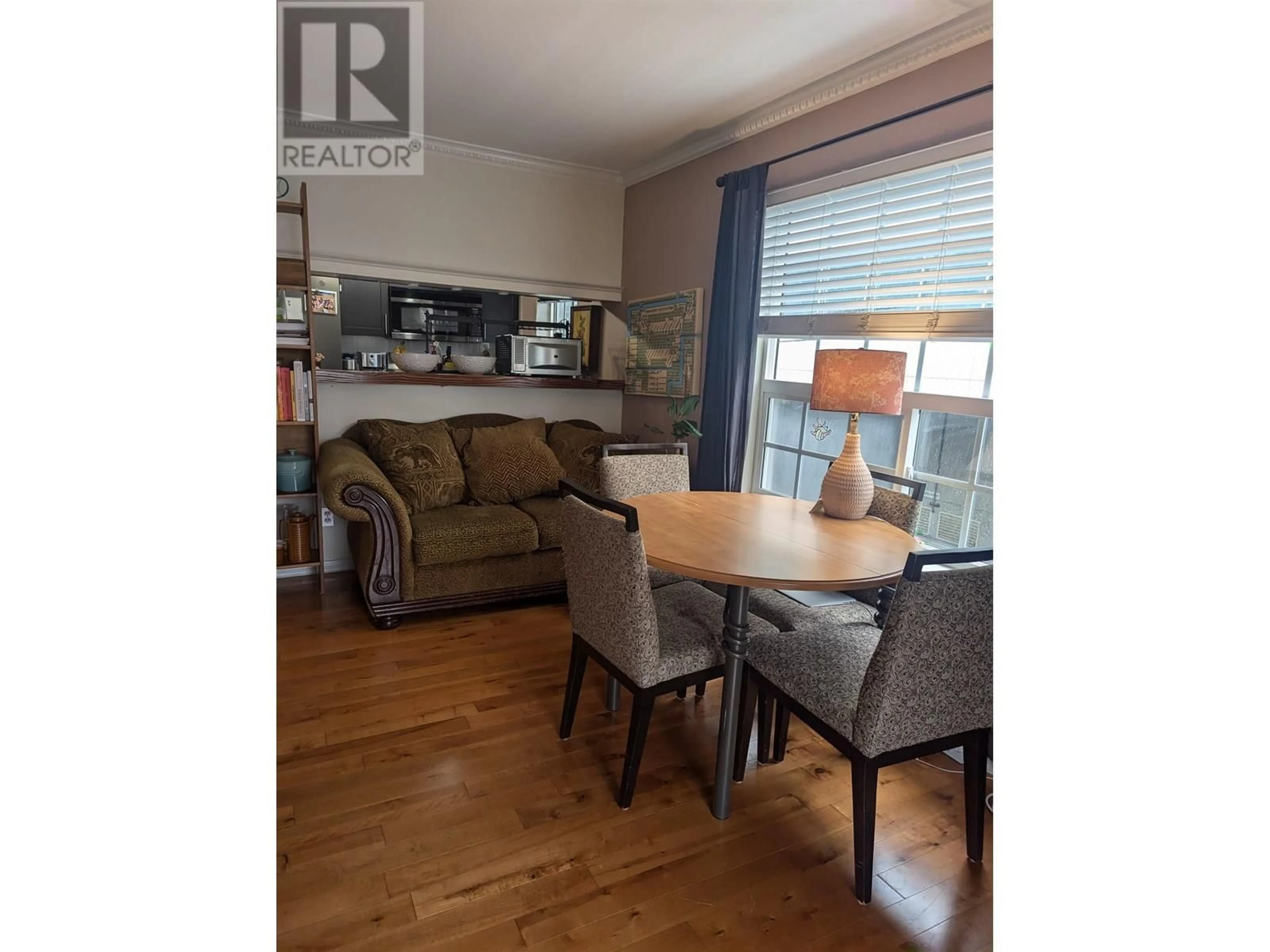Living room with furniture, wood/laminate floor for 308 - 5788 VINE STREET, Vancouver British Columbia V6M4L8