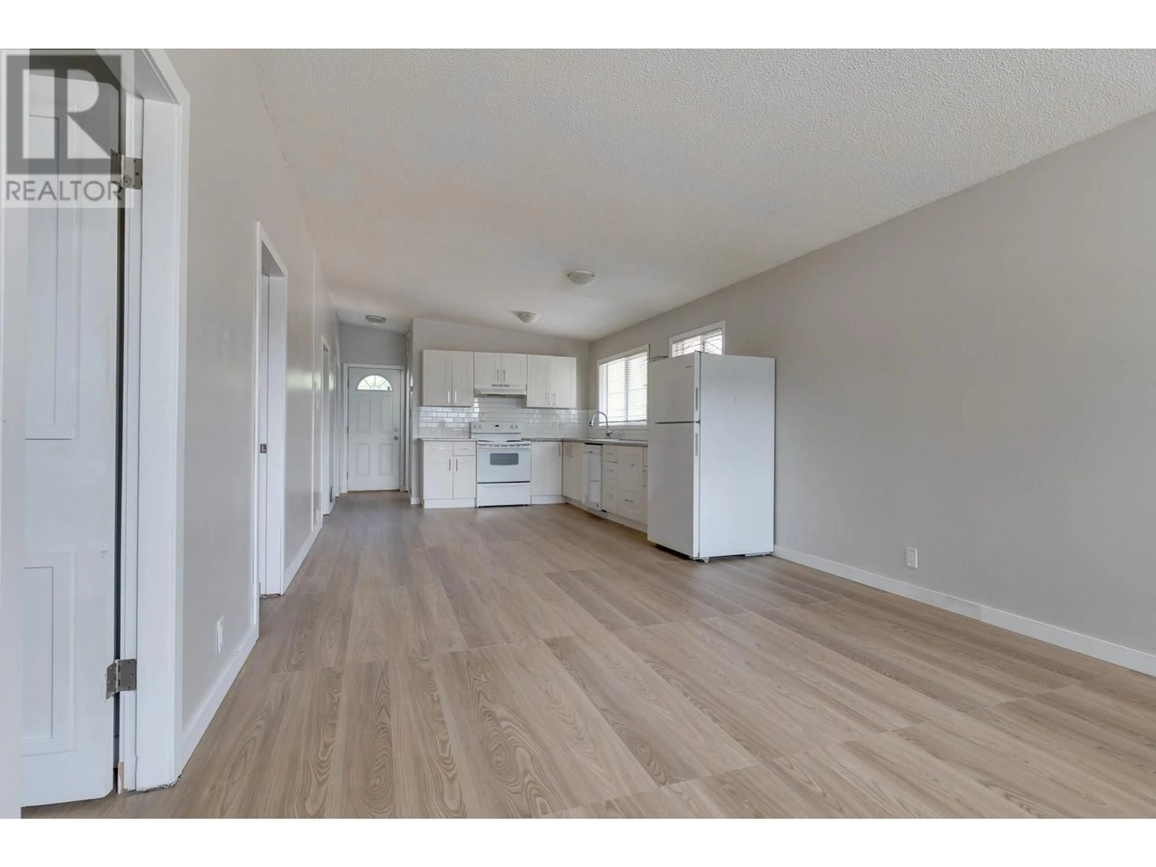 Open concept kitchen, wood/laminate floor for 545 EWERT STREET, Prince George British Columbia V2M2N8