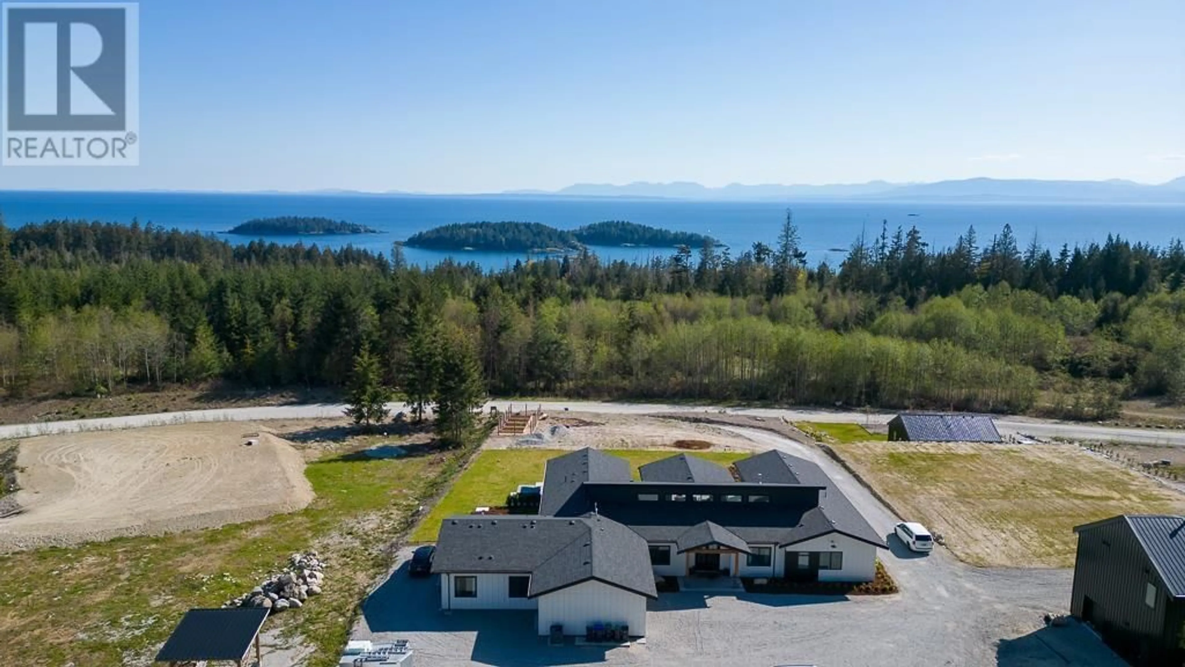 A pic from outside/outdoor area/front of a property/back of a property/a pic from drone, water/lake/river/ocean view for 6724 ACORN ROAD, Sechelt British Columbia V7Z0N3