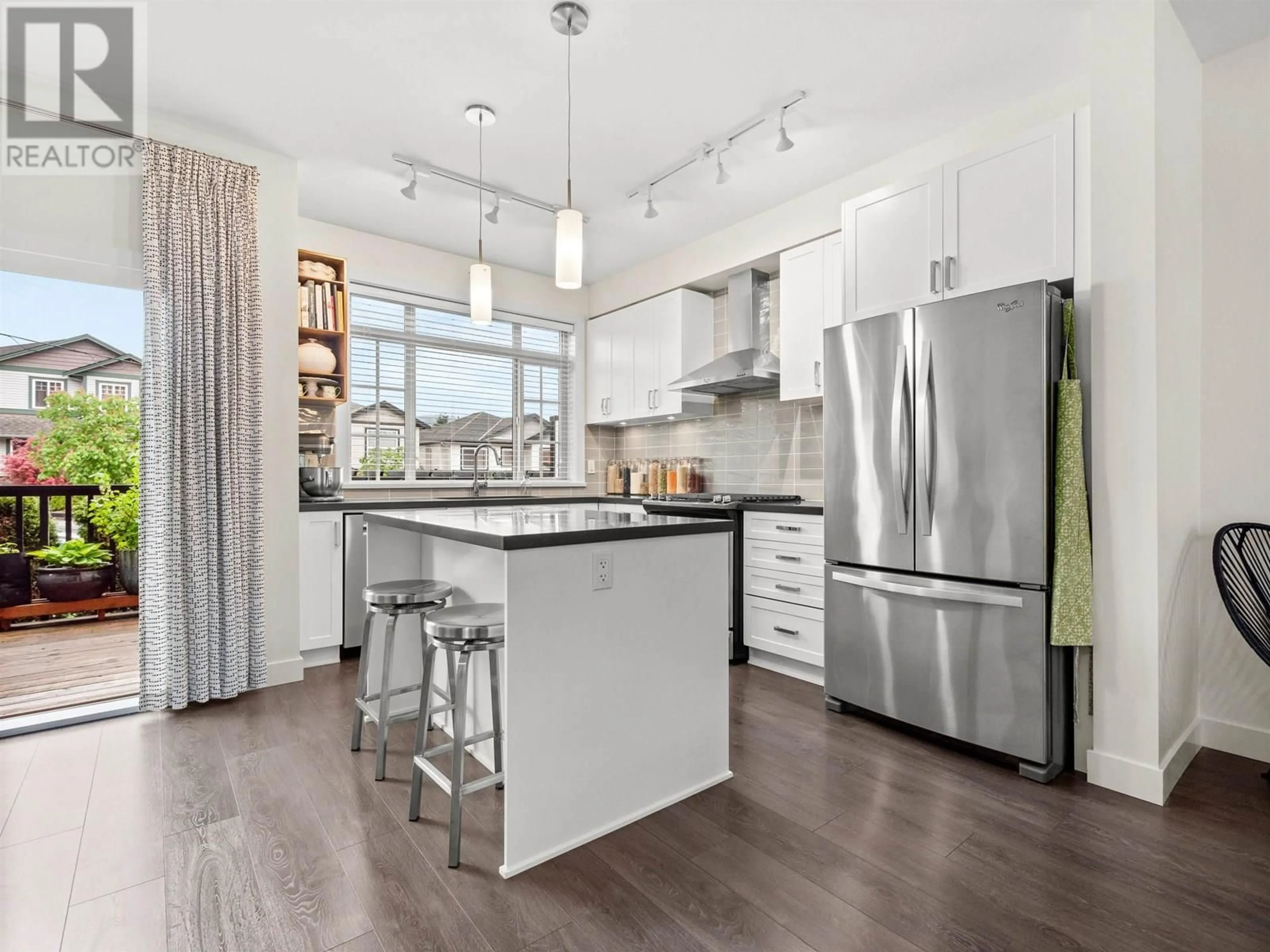 Open concept kitchen, wood/laminate floor for 3 - 11305 240 STREET, Maple Ridge British Columbia V2W0J1