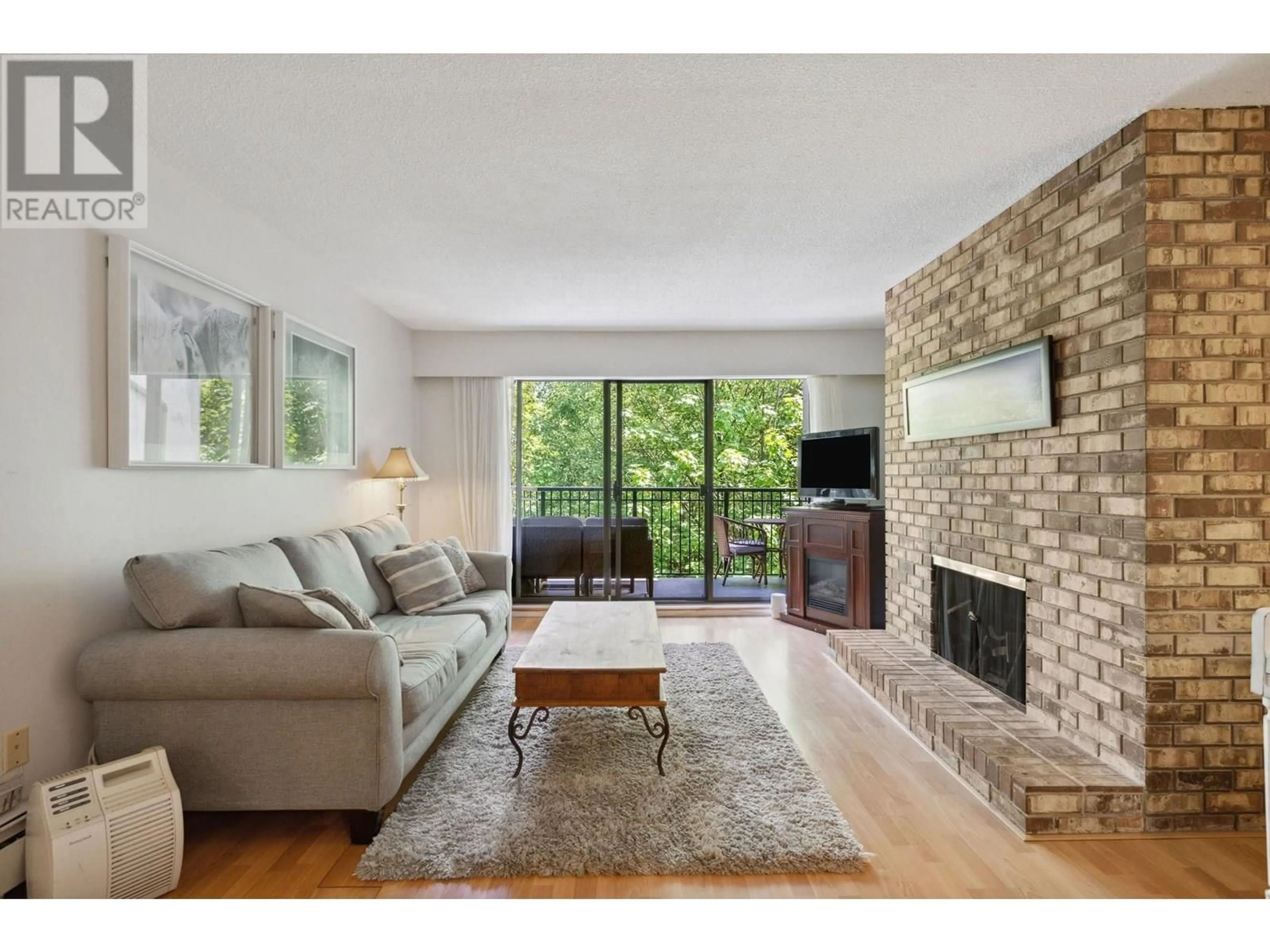 Living room with furniture, unknown for 306 - 1385 DRAYCOTT ROAD, North Vancouver British Columbia V7J3K9
