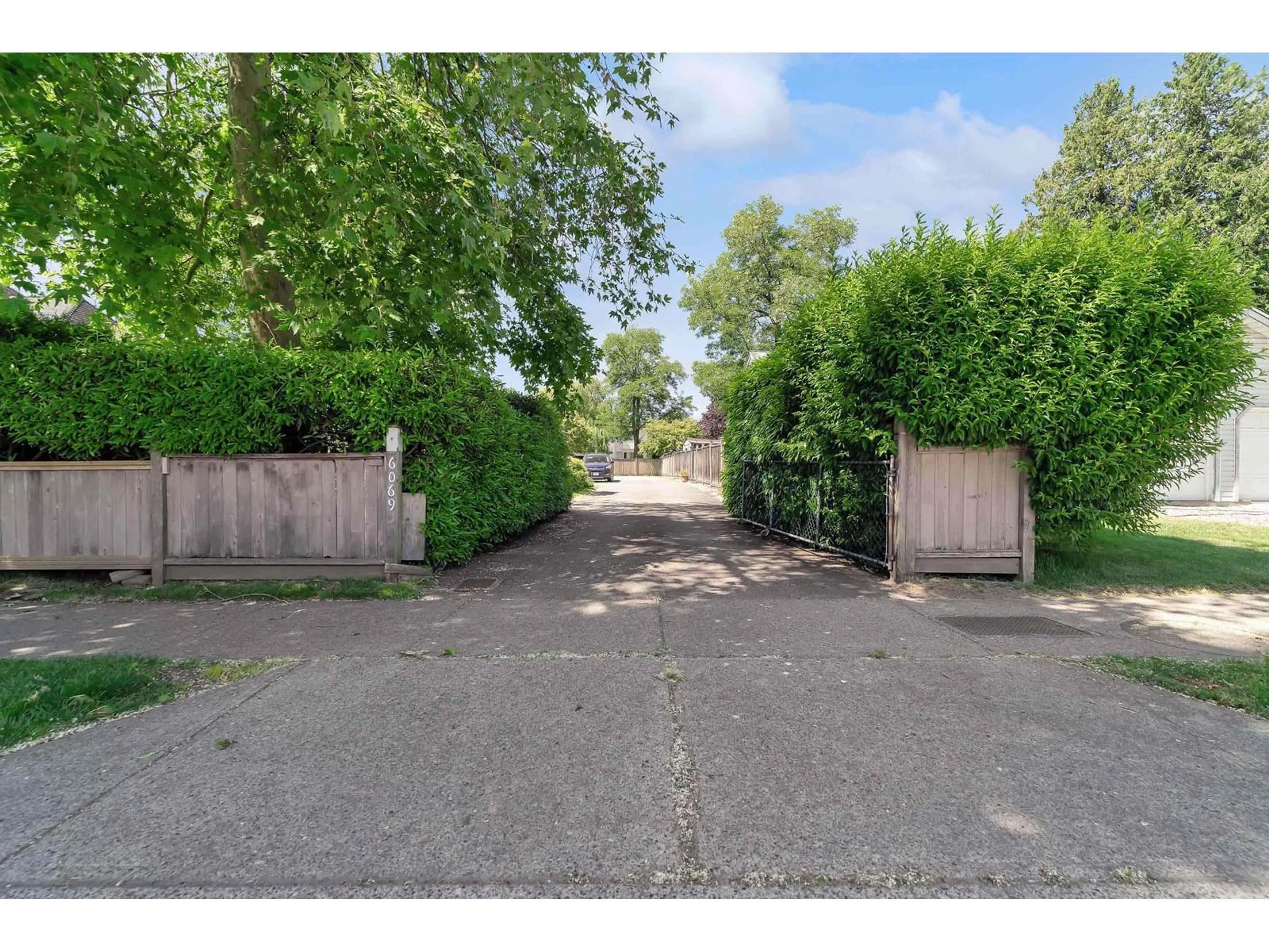 A pic from outside/outdoor area/front of a property/back of a property/a pic from drone, street for 6069 188, Surrey British Columbia V3S7V9