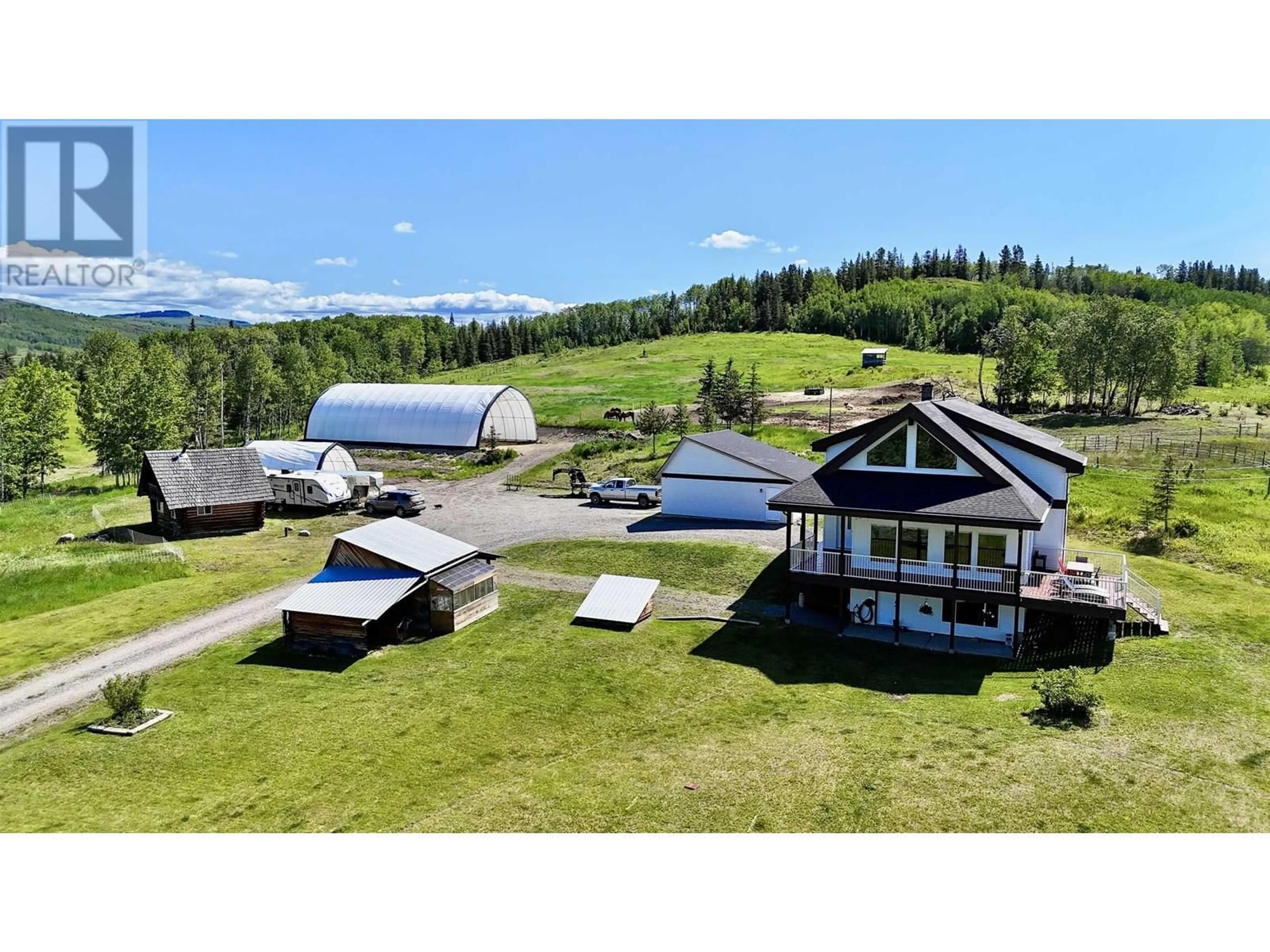 A pic from outside/outdoor area/front of a property/back of a property/a pic from drone, mountain view for 14320 16 HIGHWAY, Telkwa British Columbia V0J2X1