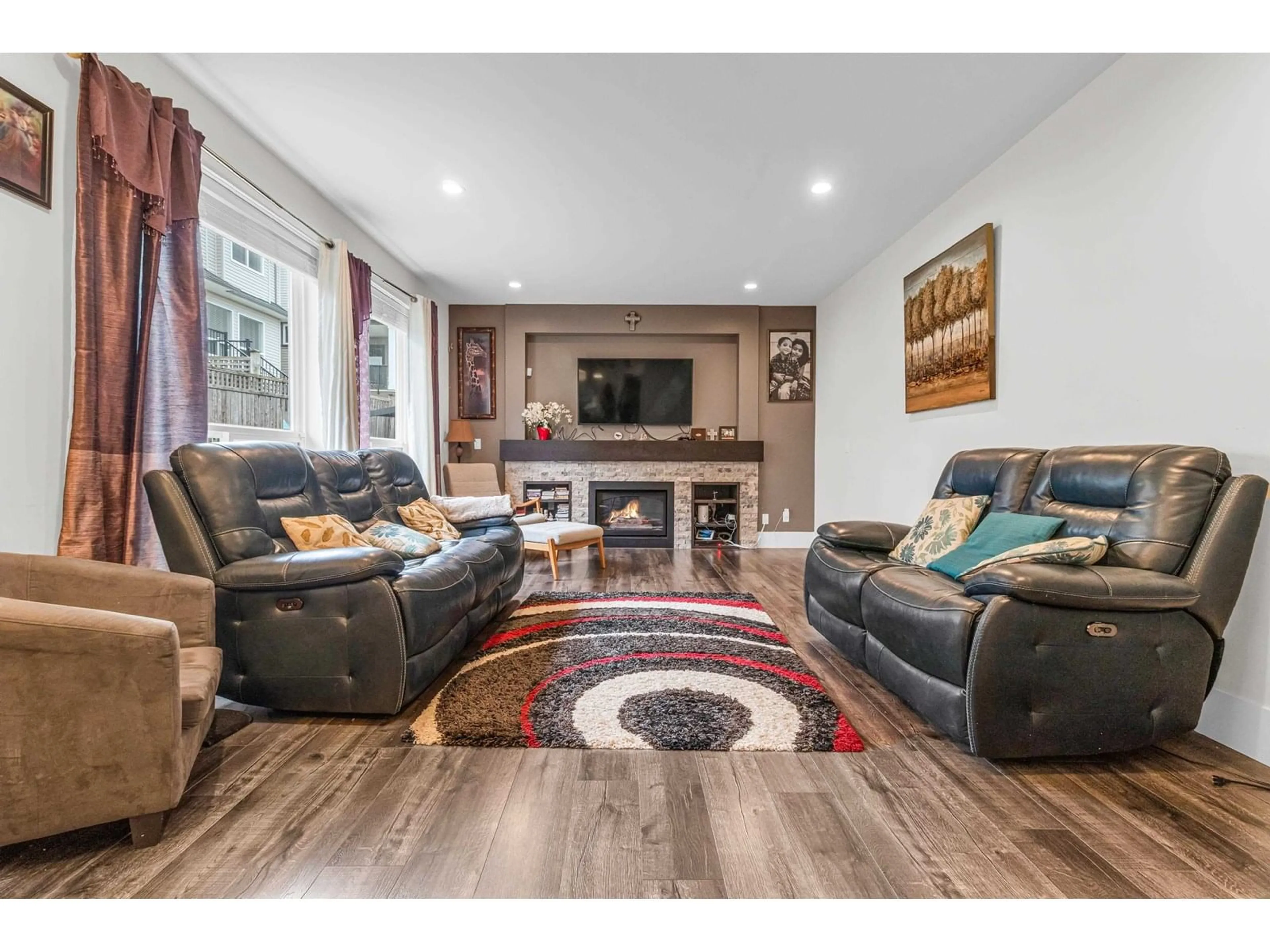 Living room with furniture, wood/laminate floor for 6121 147B, Surrey British Columbia V3S2L8