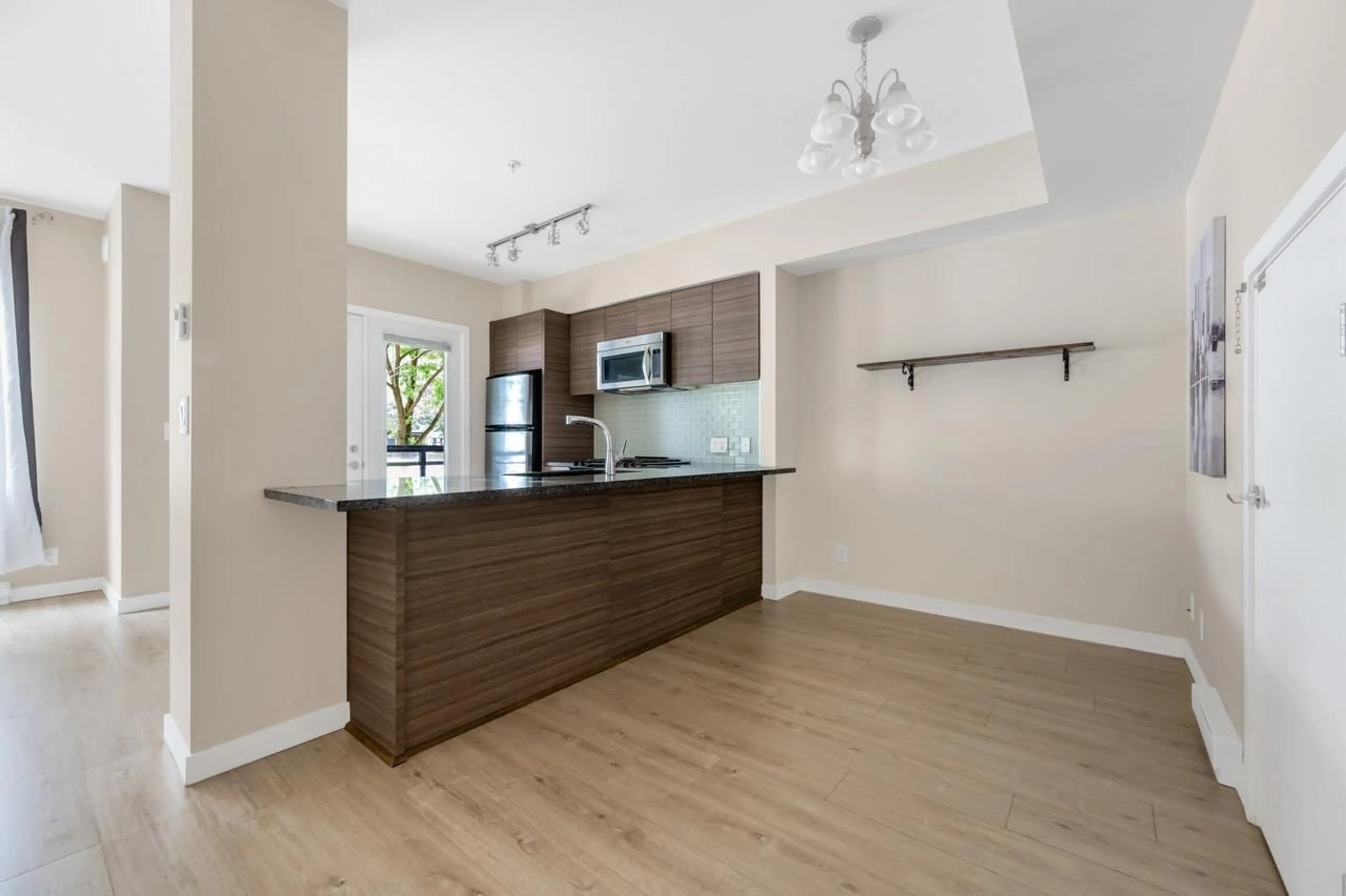 Open concept kitchen, wood/laminate floor for 103 - 13228 OLD YALE, Surrey British Columbia V3T0K3