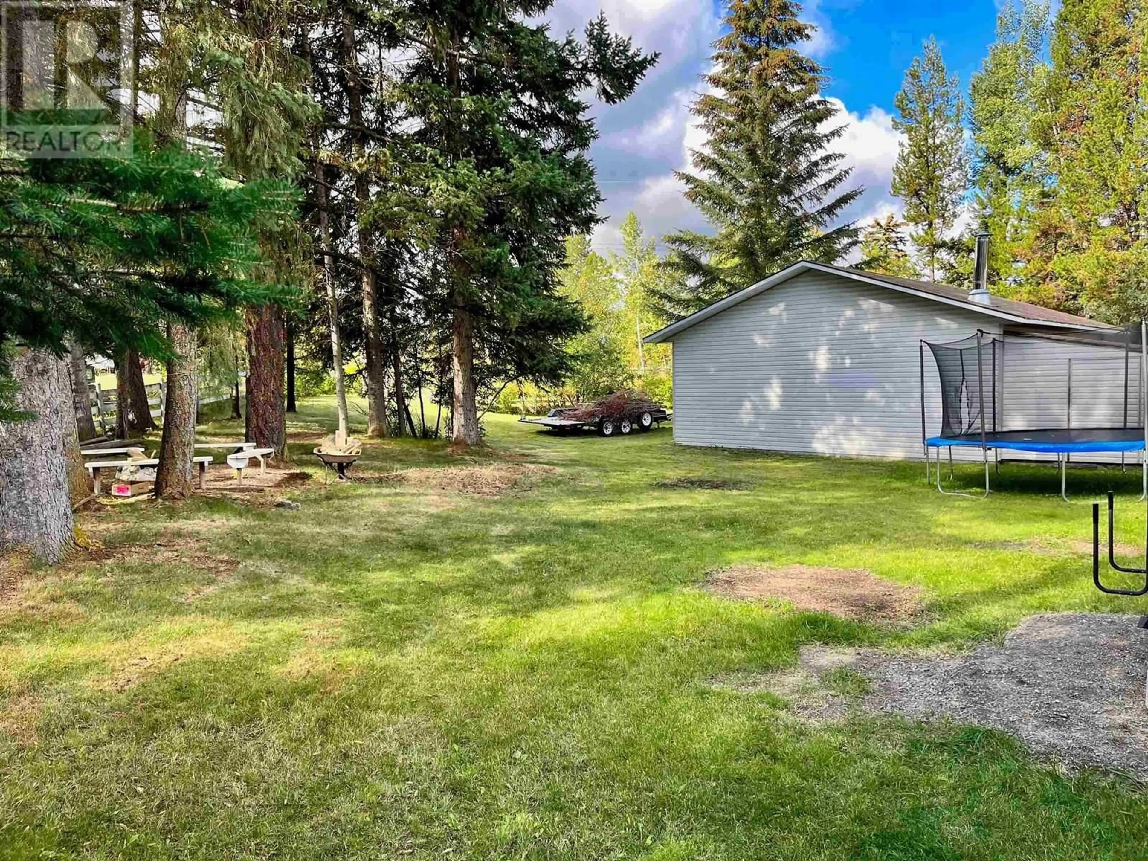 A pic from outside/outdoor area/front of a property/back of a property/a pic from drone, forest/trees view for 6485 MERCER ROAD, 100 Mile House British Columbia V0K2E3