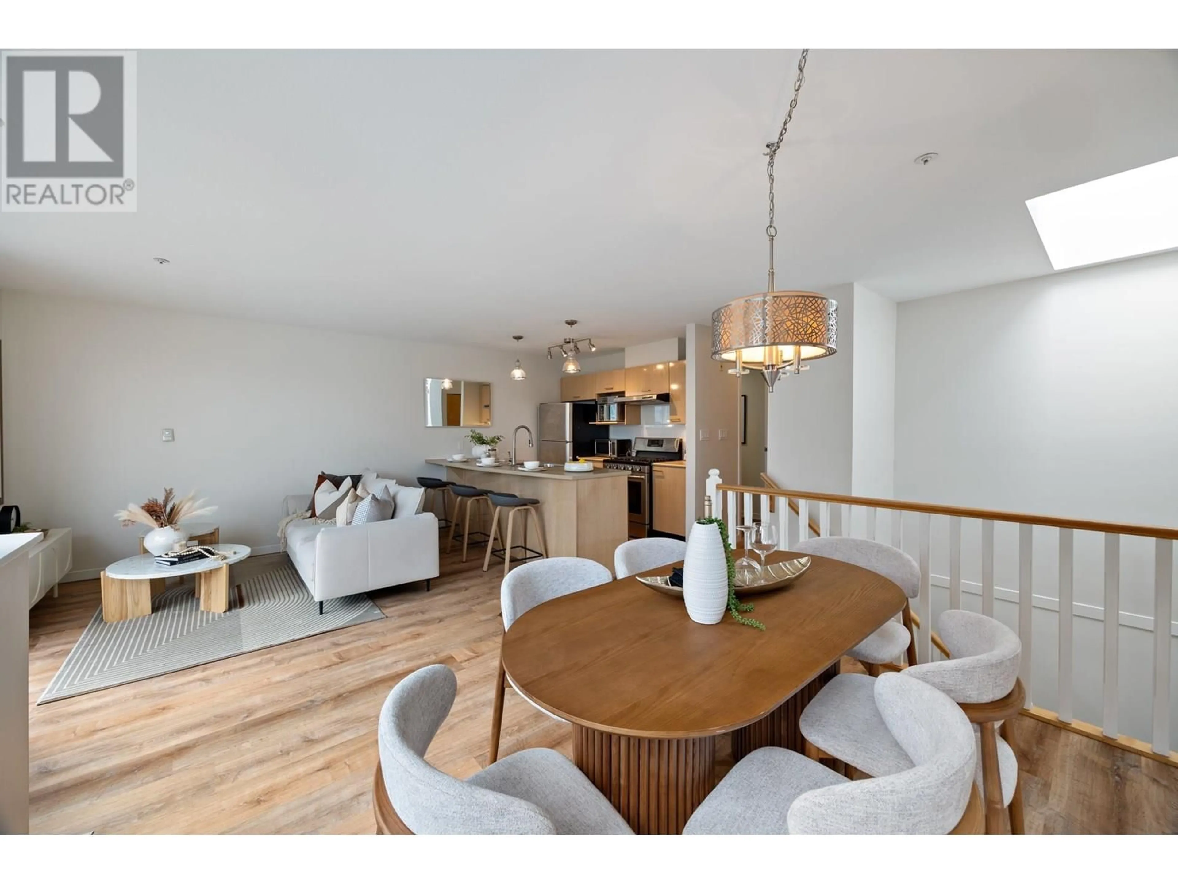 Open concept kitchen, wood/laminate floor for 313 - 638 7TH AVENUE, Vancouver British Columbia V5Z1B5