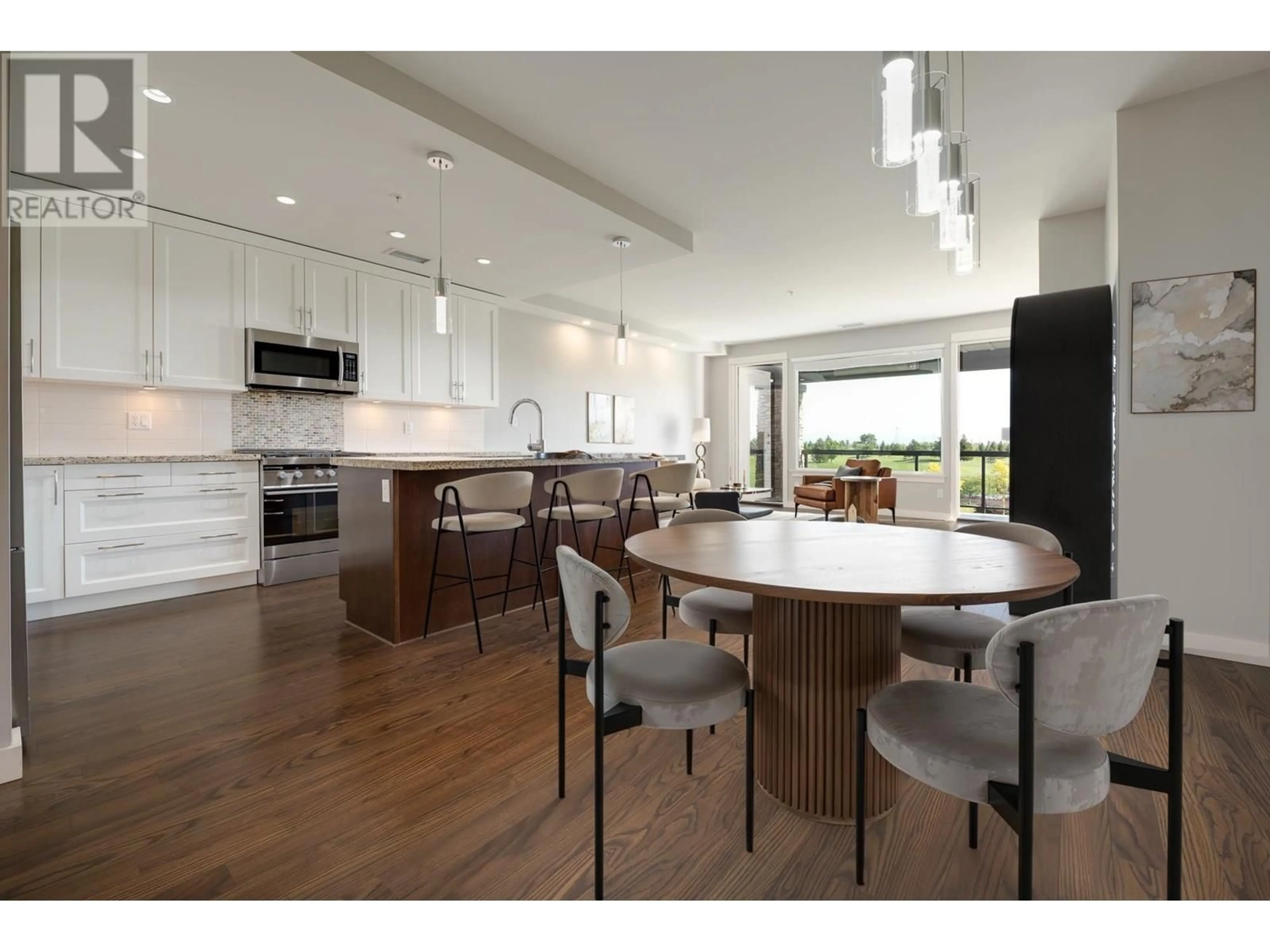 Open concept kitchen, wood/laminate floor for 210 - 5099 SPRINGS BOULEVARD, Delta British Columbia V4M0A2