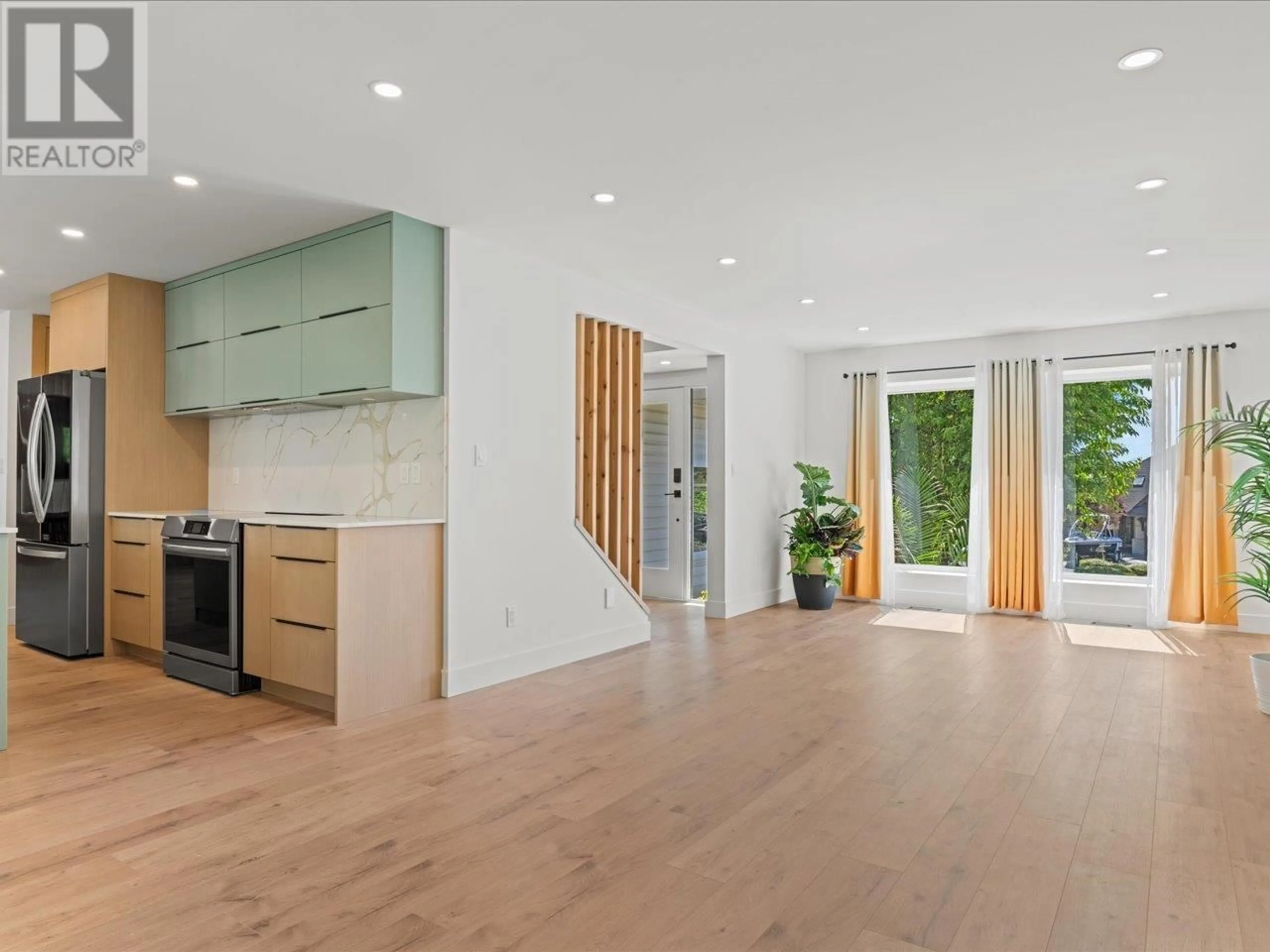 Open concept kitchen, wood/laminate floor for 1135 SETTLERS COURT, Port Coquitlam British Columbia V3C5Y5