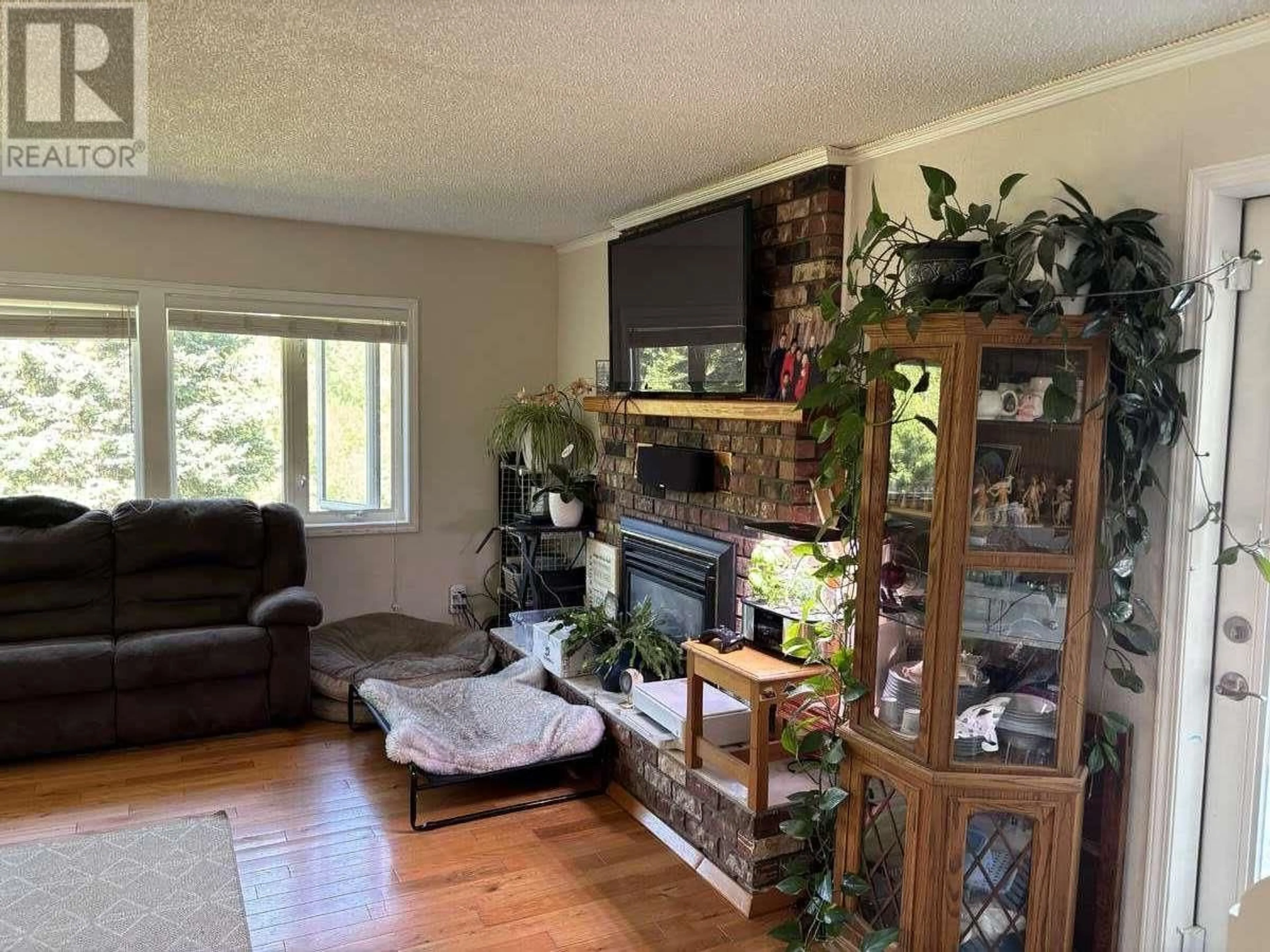 Living room with furniture, wood/laminate floor for 13150 SCOTT ROAD, Prince George British Columbia V2N6A8