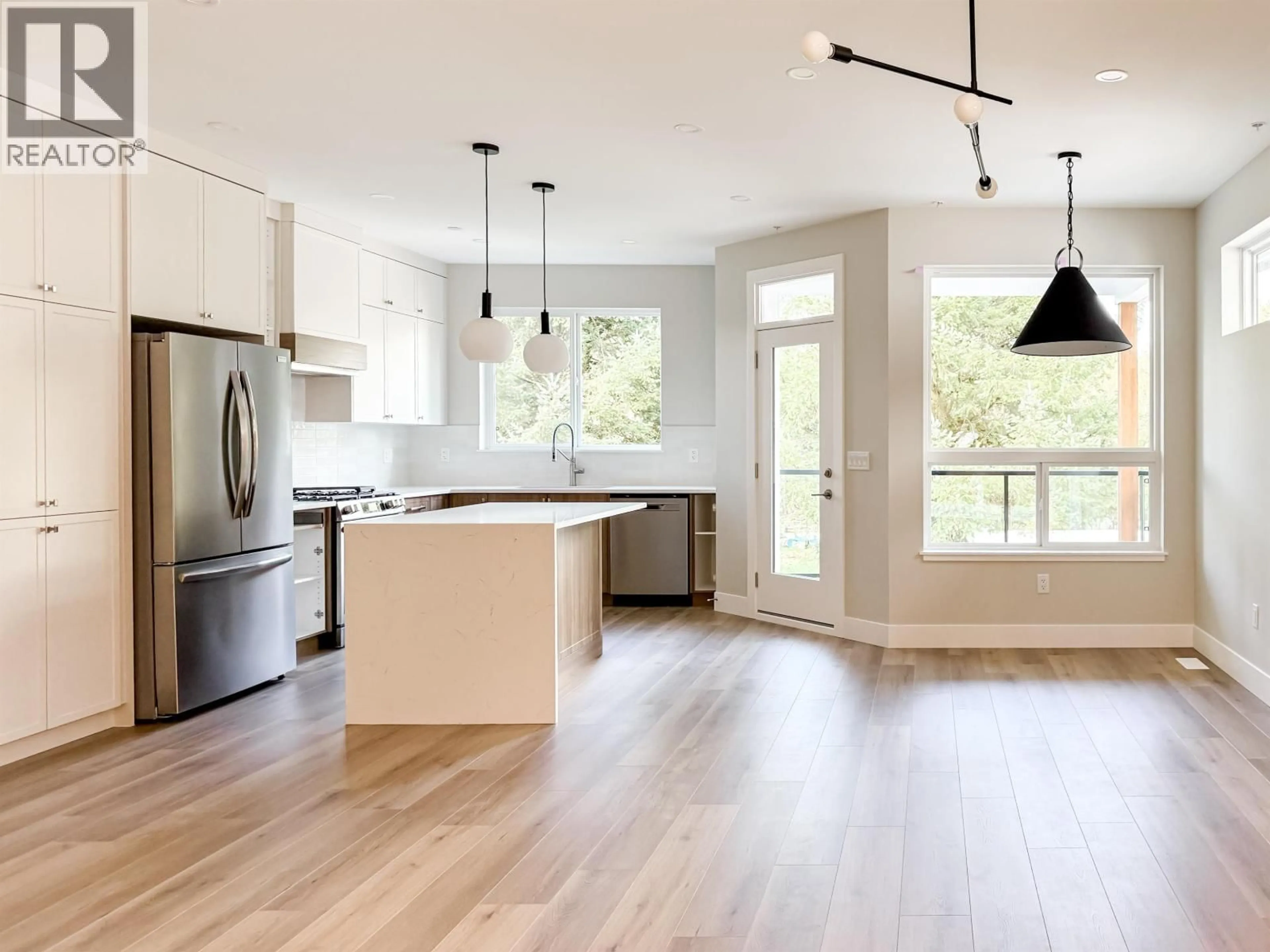 Open concept kitchen, wood/laminate floor for A - 21435 121 AVENUE, Maple Ridge British Columbia V2X3S5