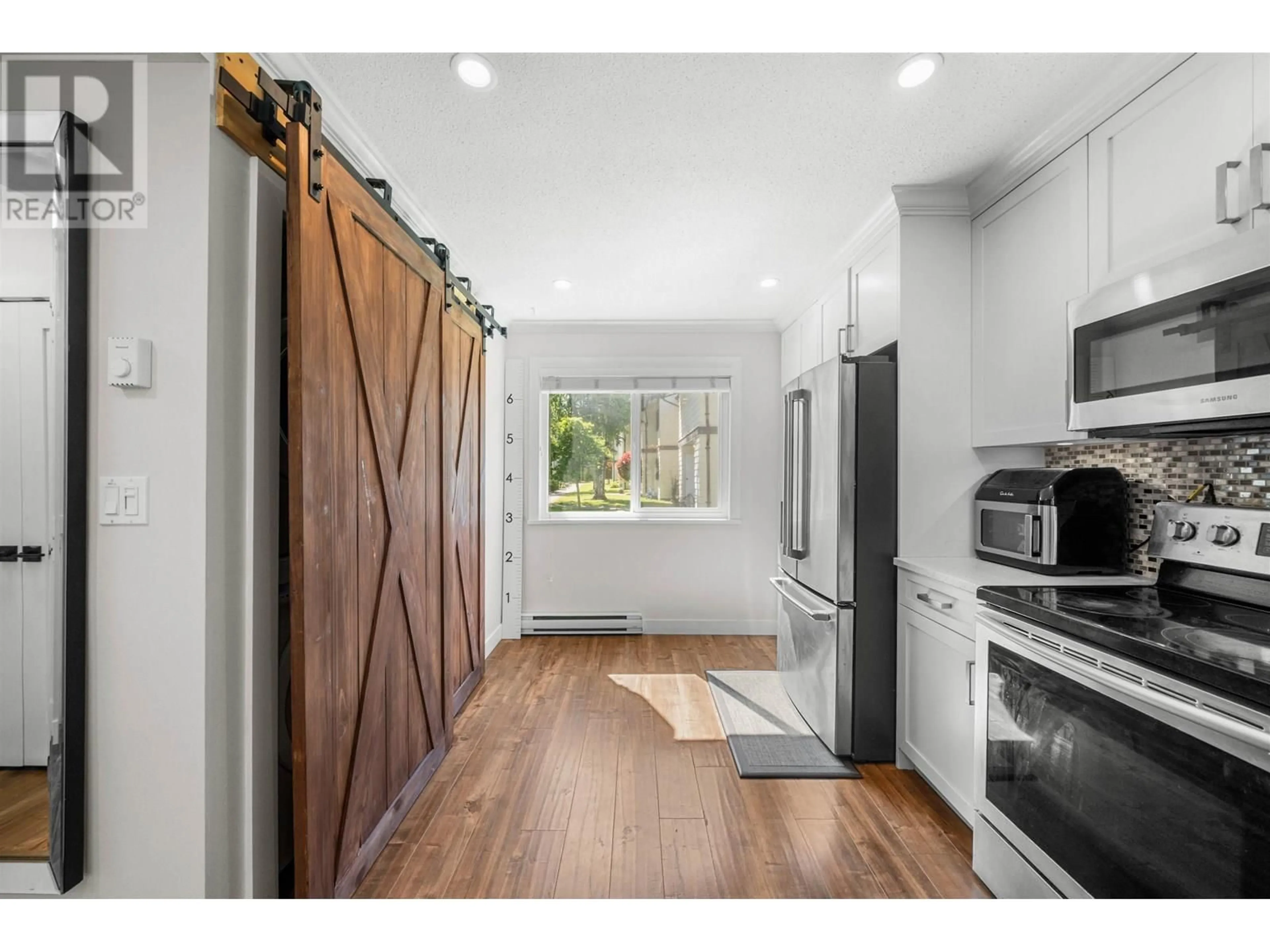 Open concept kitchen, wood/laminate floor for 42 - 4800 TRIMARAN DRIVE, Richmond British Columbia V7E4Y7
