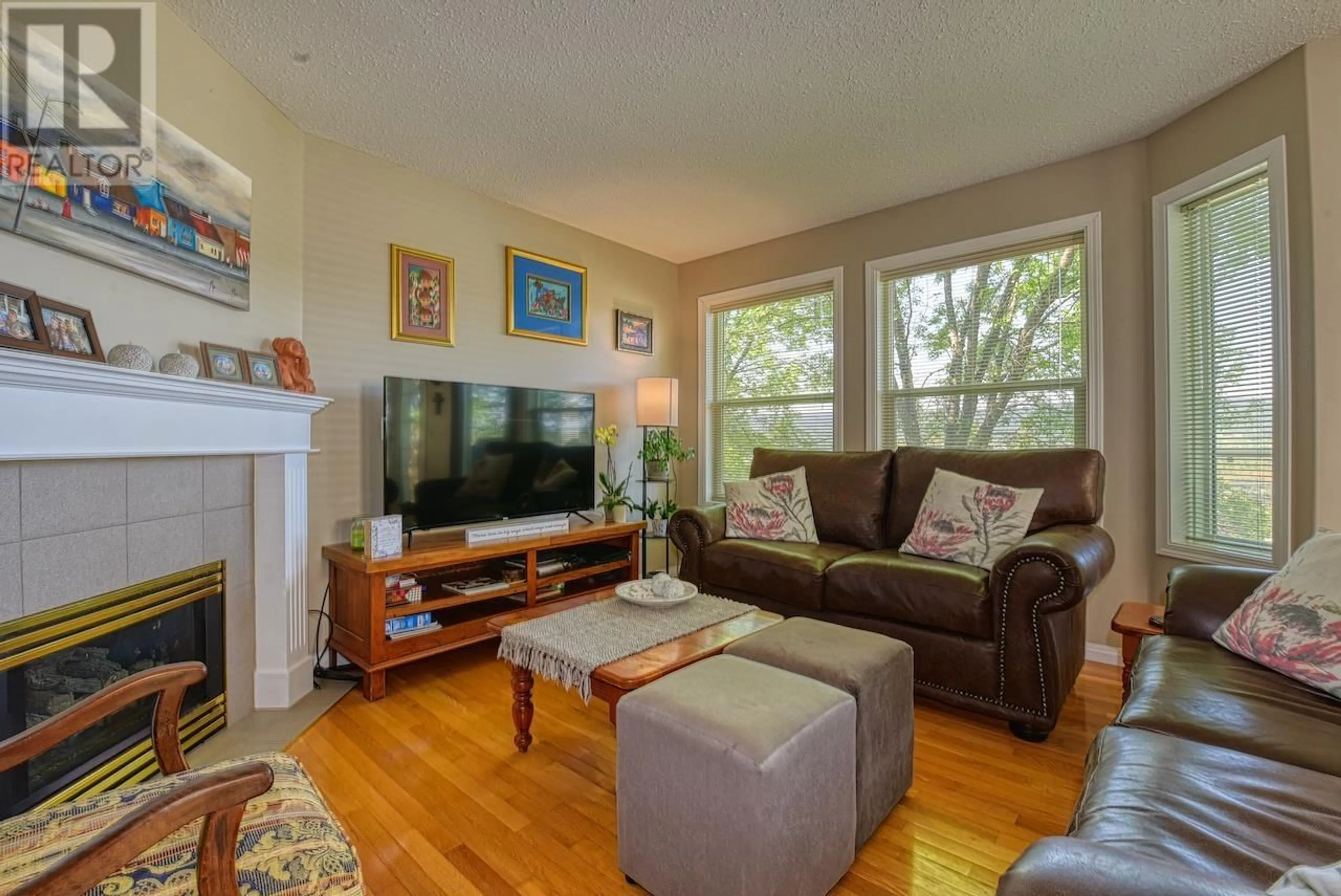 Living room with furniture, wood/laminate floor for 19 - 350 PEARKES DRIVE, Williams Lake British Columbia V2G4T2