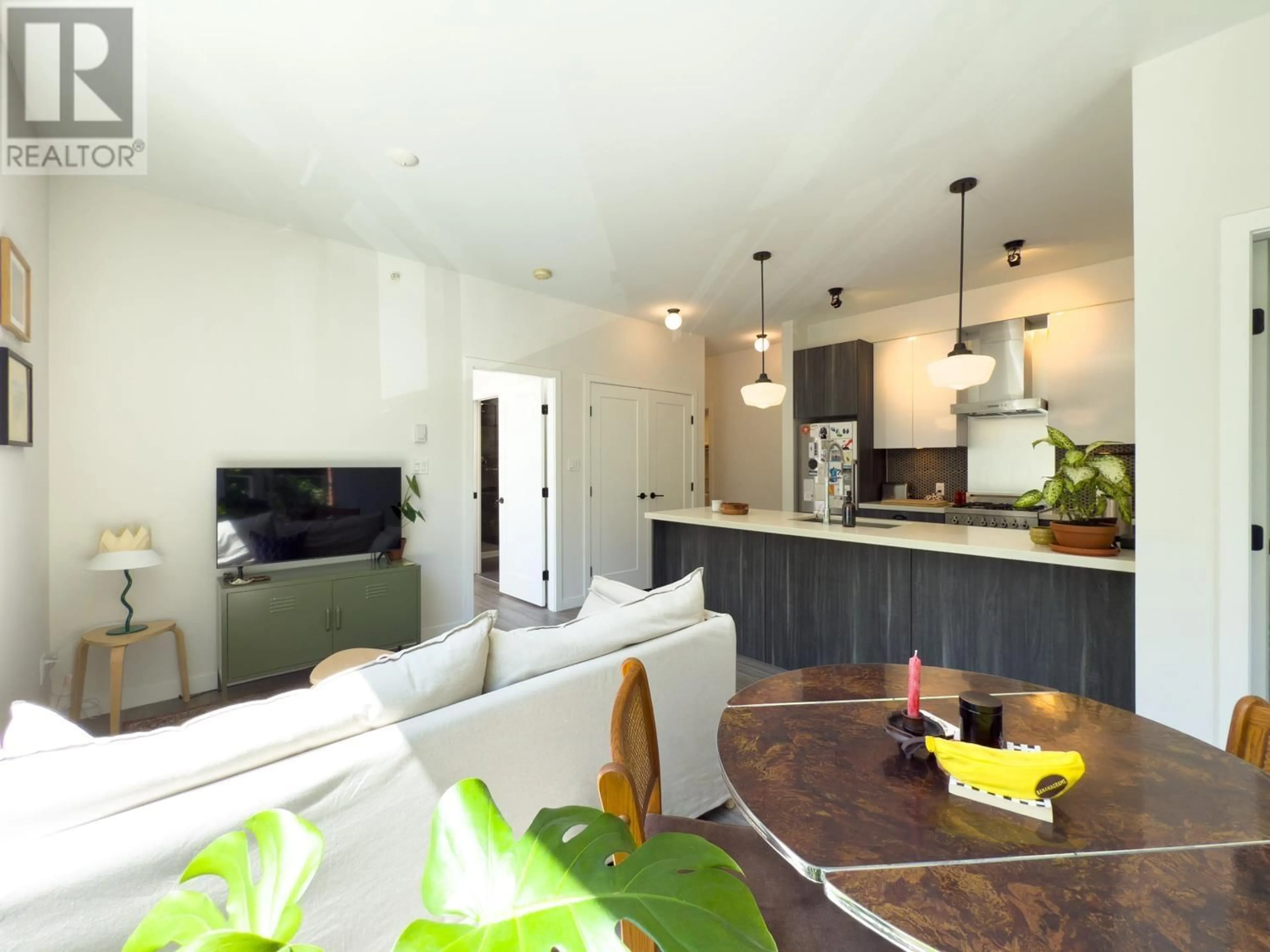 Open concept kitchen, wood/laminate floor for 208 - 311 6TH AVENUE, Vancouver British Columbia V5T1J9