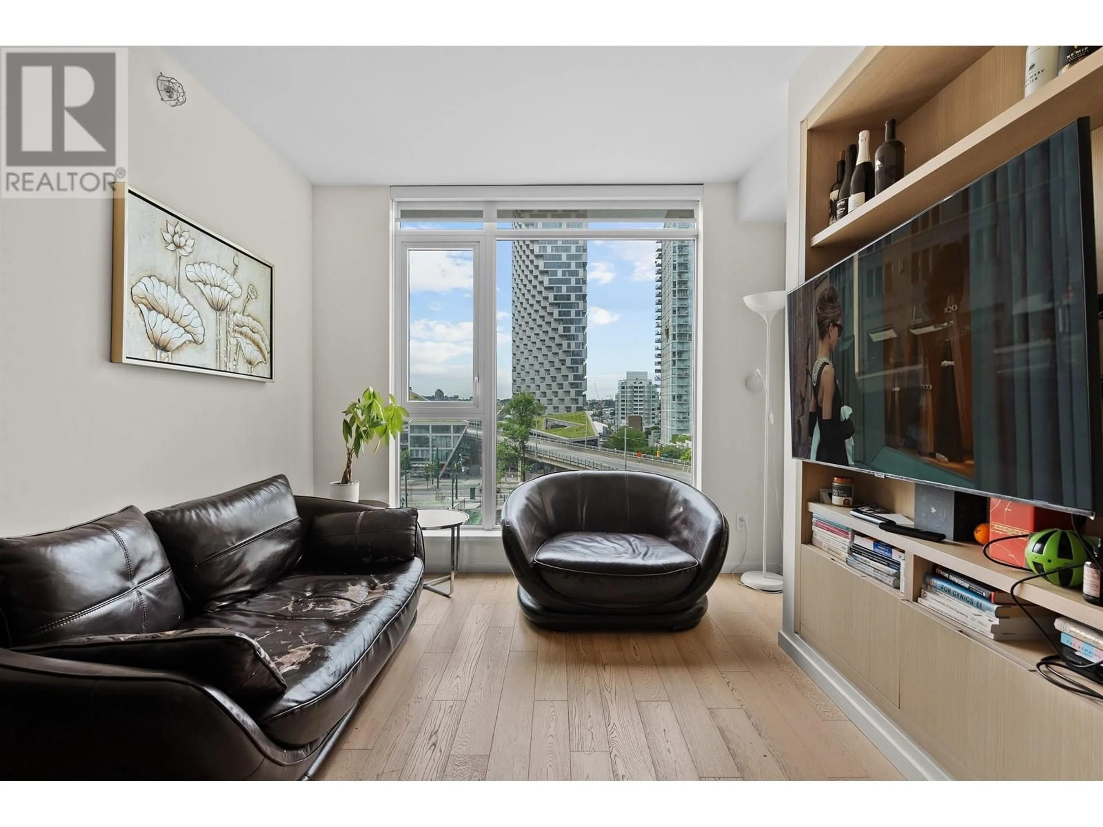 Living room with furniture, wood/laminate floor for 611 - 1351 CONTINENTAL STREET, Vancouver British Columbia V6Z0C6