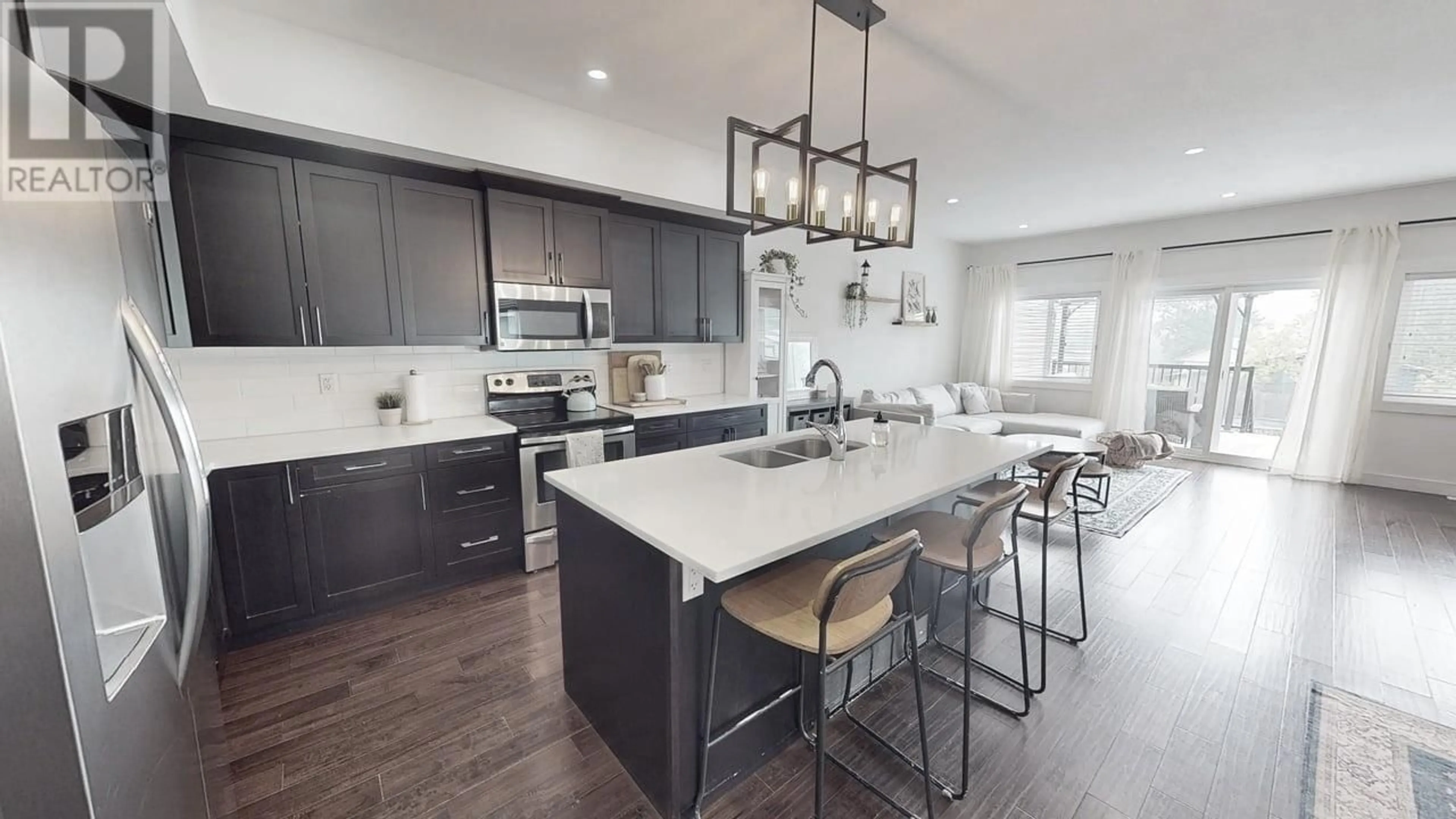 Open concept kitchen, ceramic/tile floor for 8622 74 STREET, Fort St. John British Columbia V1J7J6