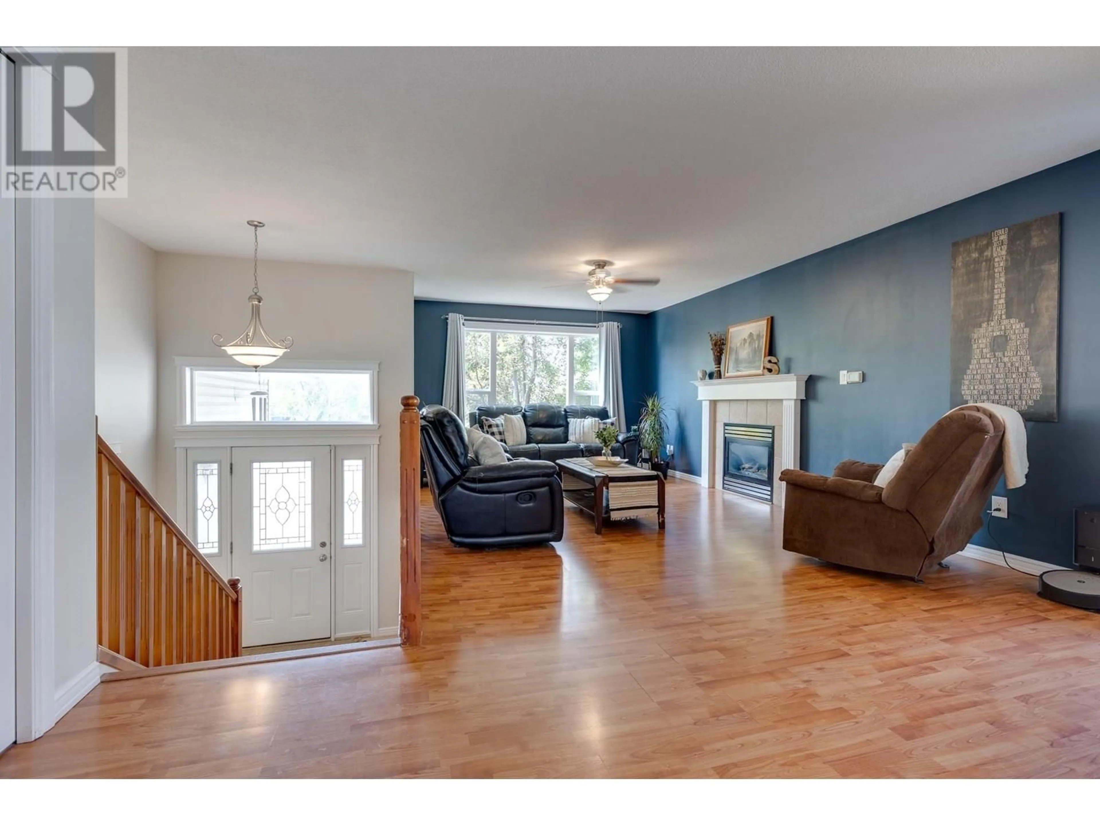 Living room with furniture, wood/laminate floor for 1866 BACHINSKI CRESCENT, Prince George British Columbia V2N6S8