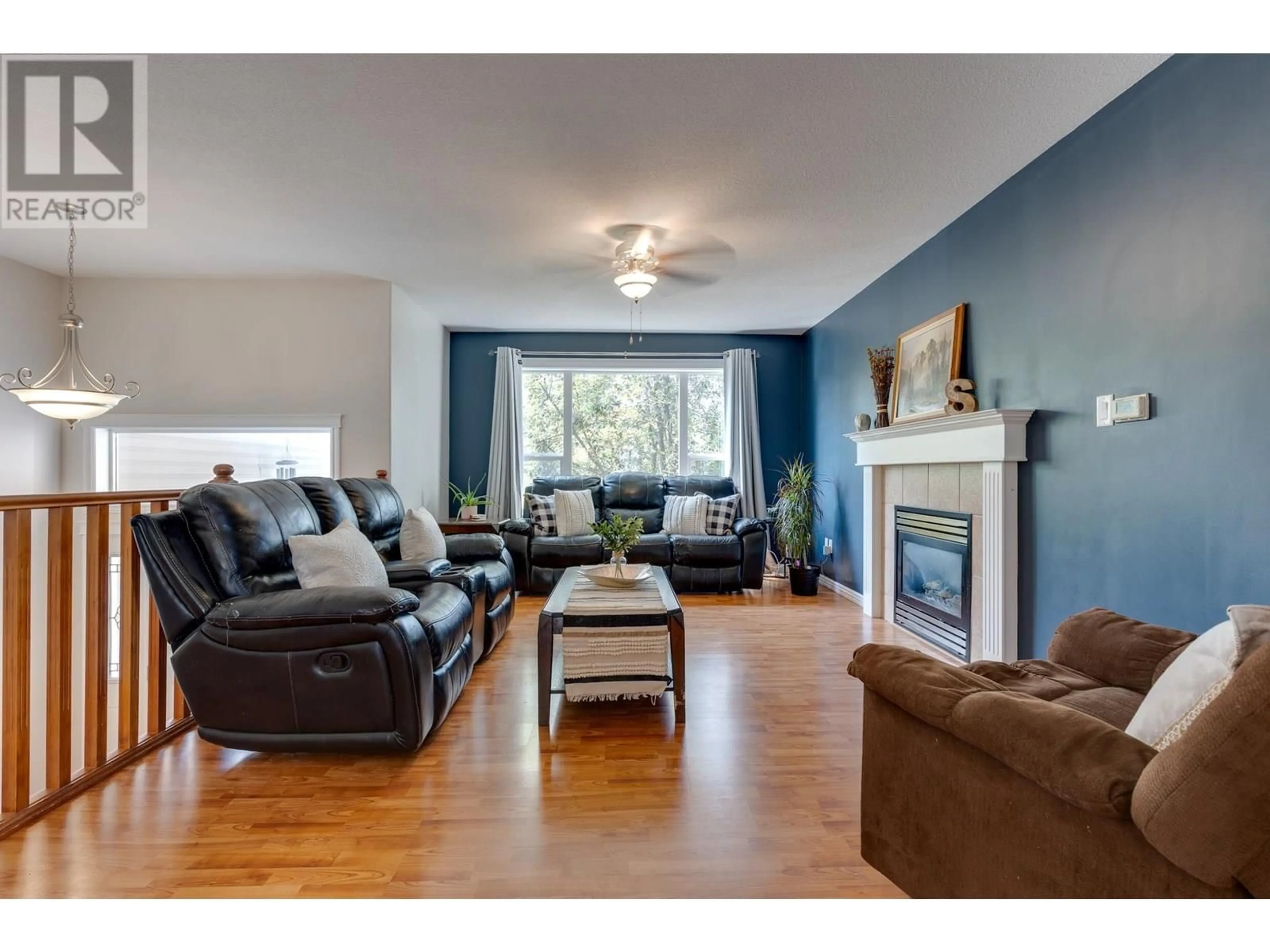 Living room with furniture, wood/laminate floor for 1866 BACHINSKI CRESCENT, Prince George British Columbia V2N6S8