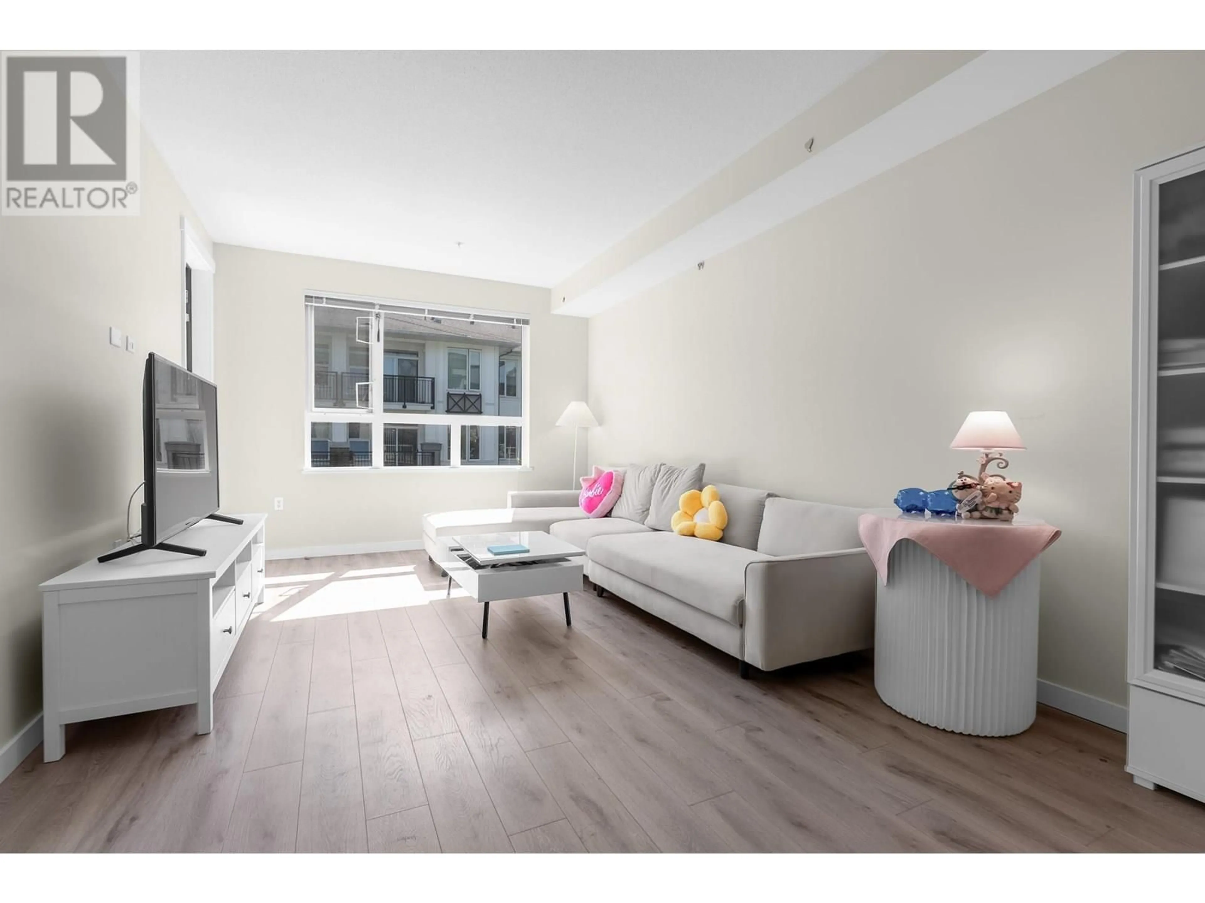 Living room with furniture, wood/laminate floor for 315 - 9233 ODLIN ROAD, Richmond British Columbia V6X0V4