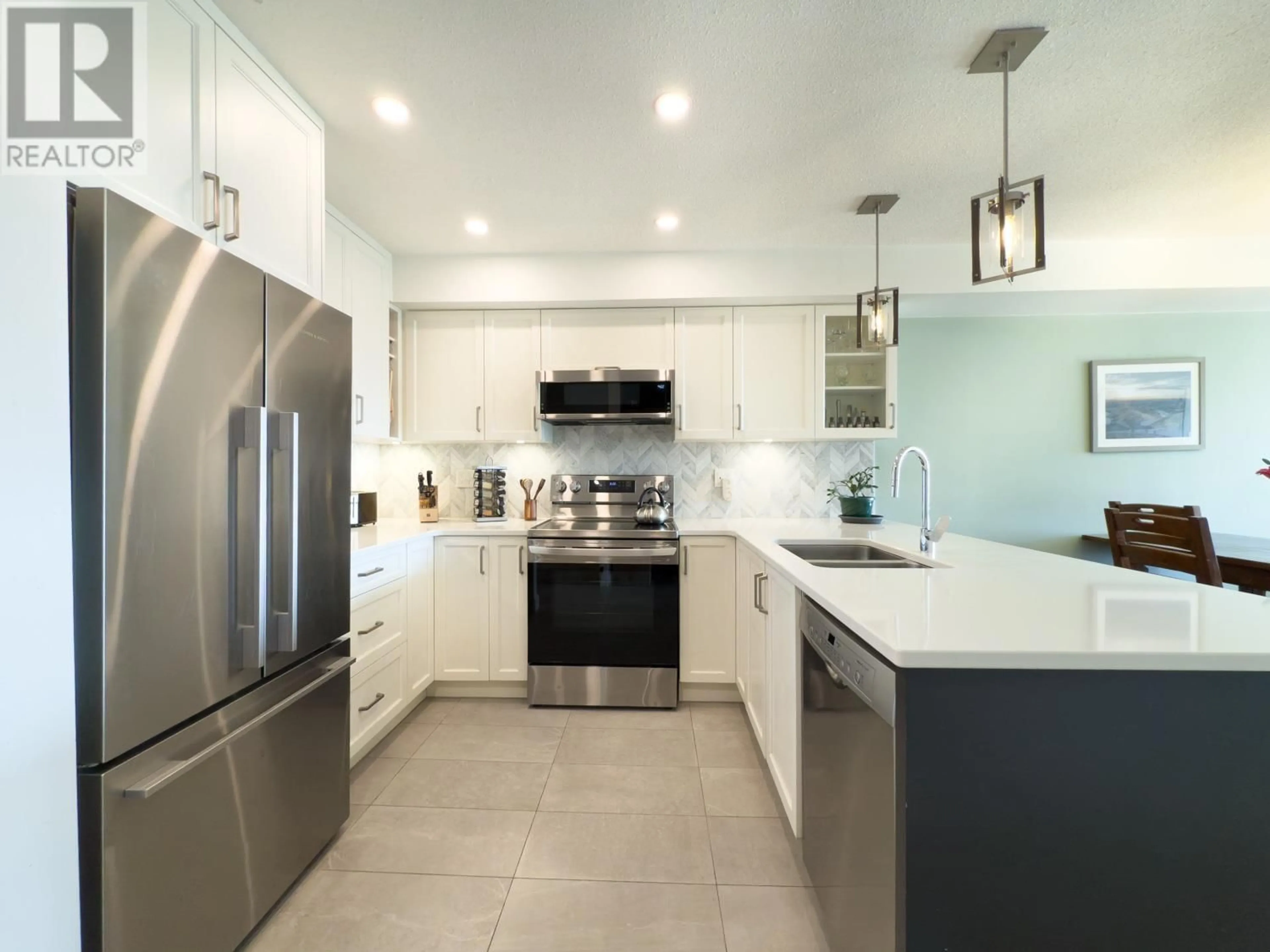 Contemporary kitchen, ceramic/tile floor for 306 - 1707 CHARLES STREET, Vancouver British Columbia V5L2T6