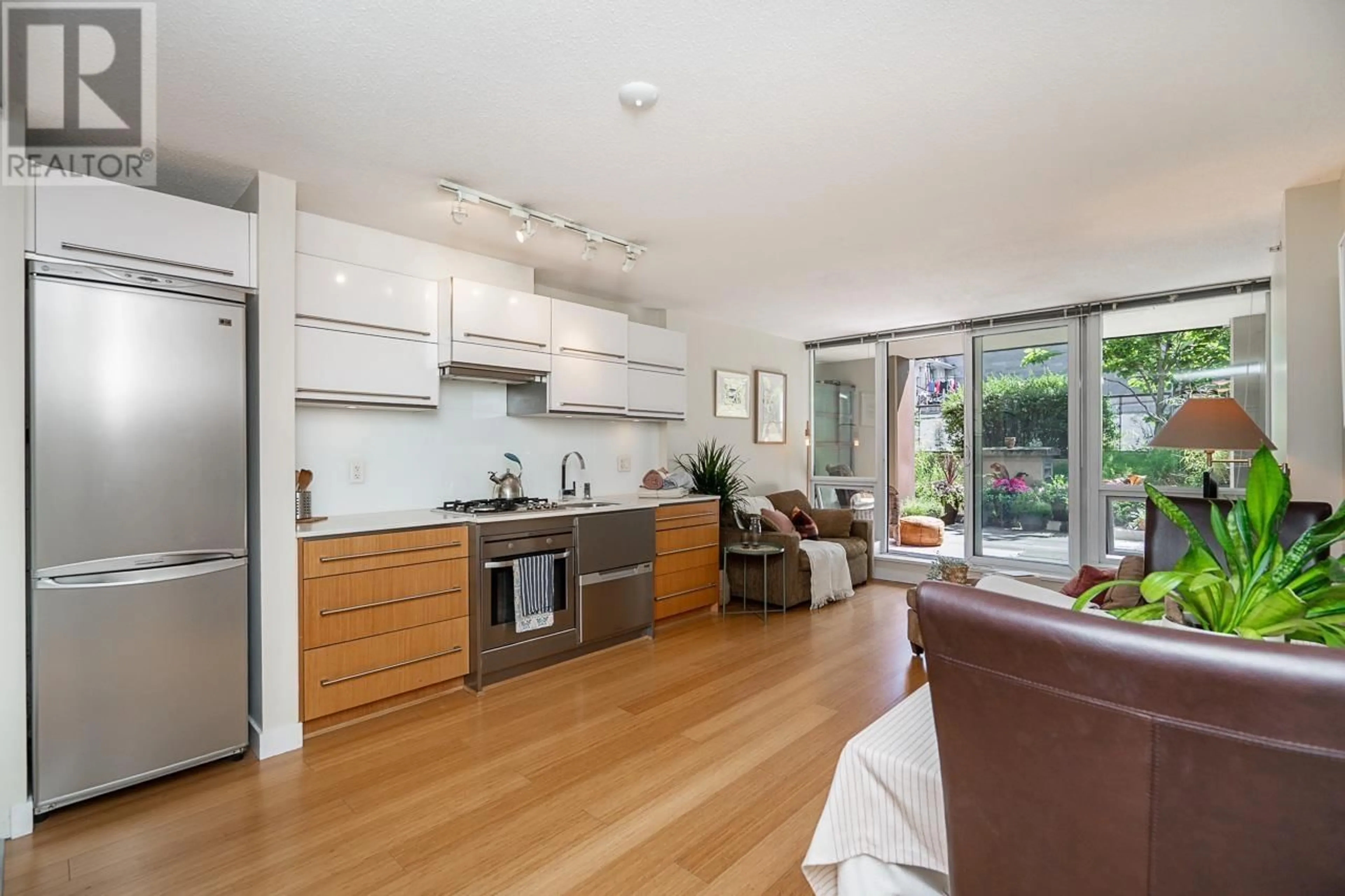 Open concept kitchen, wood/laminate floor for 209 - 718 MAIN STREET, Vancouver British Columbia V6A0B1