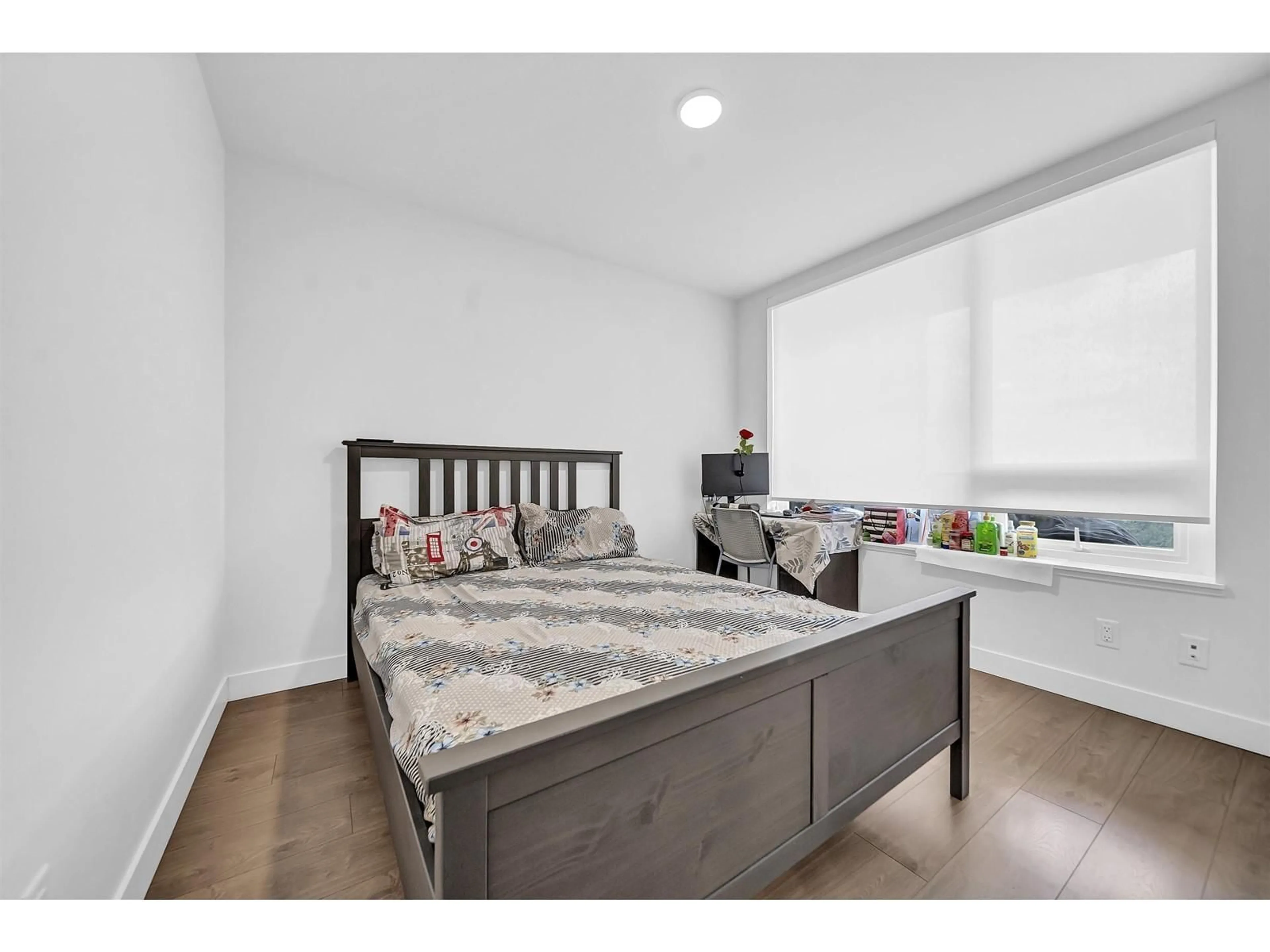 Bedroom with bed, wood/laminate floor for 1408 - 13359 OLD YALE, Surrey British Columbia V3T0S4
