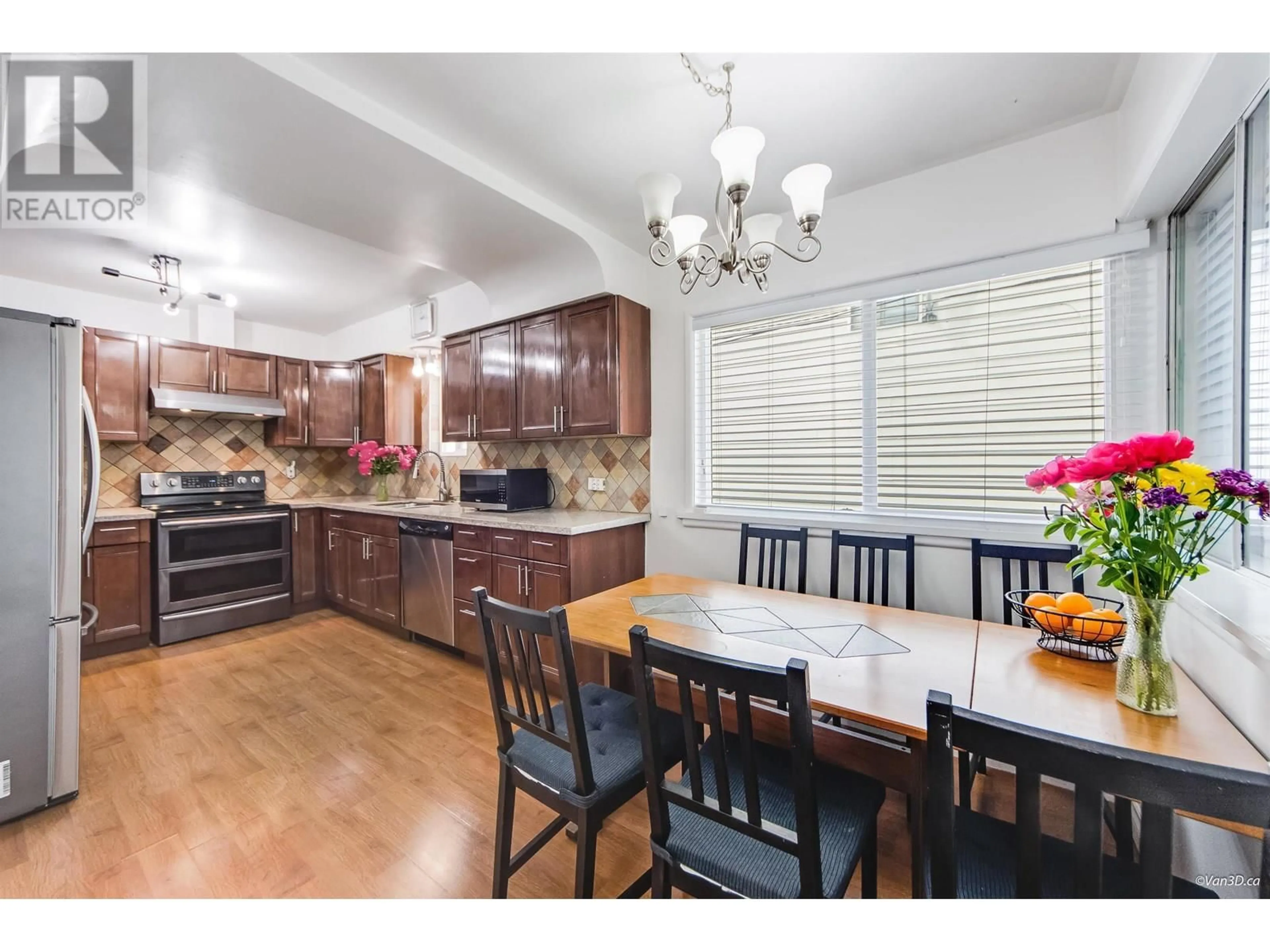 Open concept kitchen, wood/laminate floor for 6596 KNIGHT STREET, Vancouver British Columbia V5P2W2