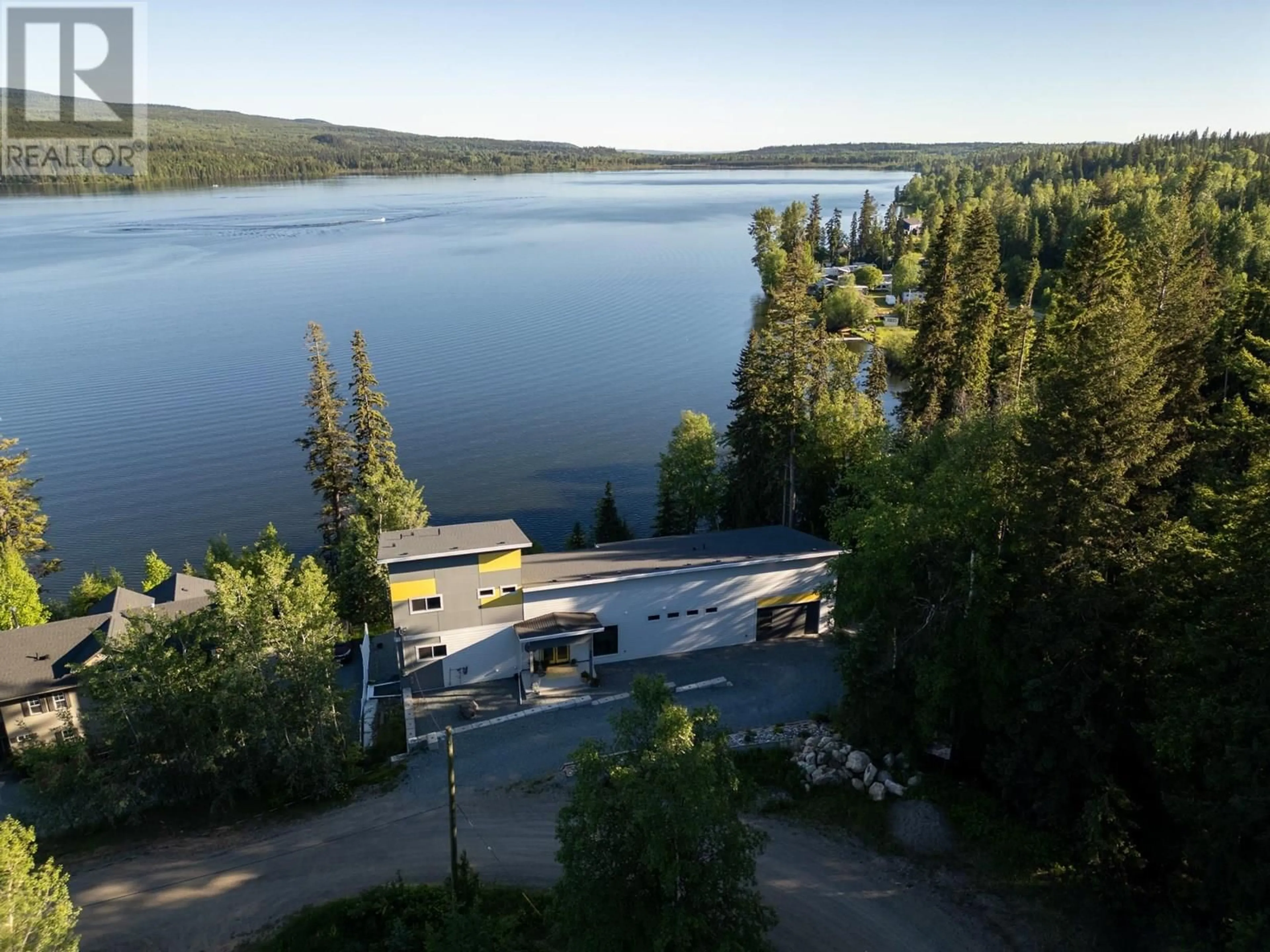 A pic from outside/outdoor area/front of a property/back of a property/a pic from drone, water/lake/river/ocean view for 140 RONDANE CRESCENT, Prince George British Columbia V2N6W3