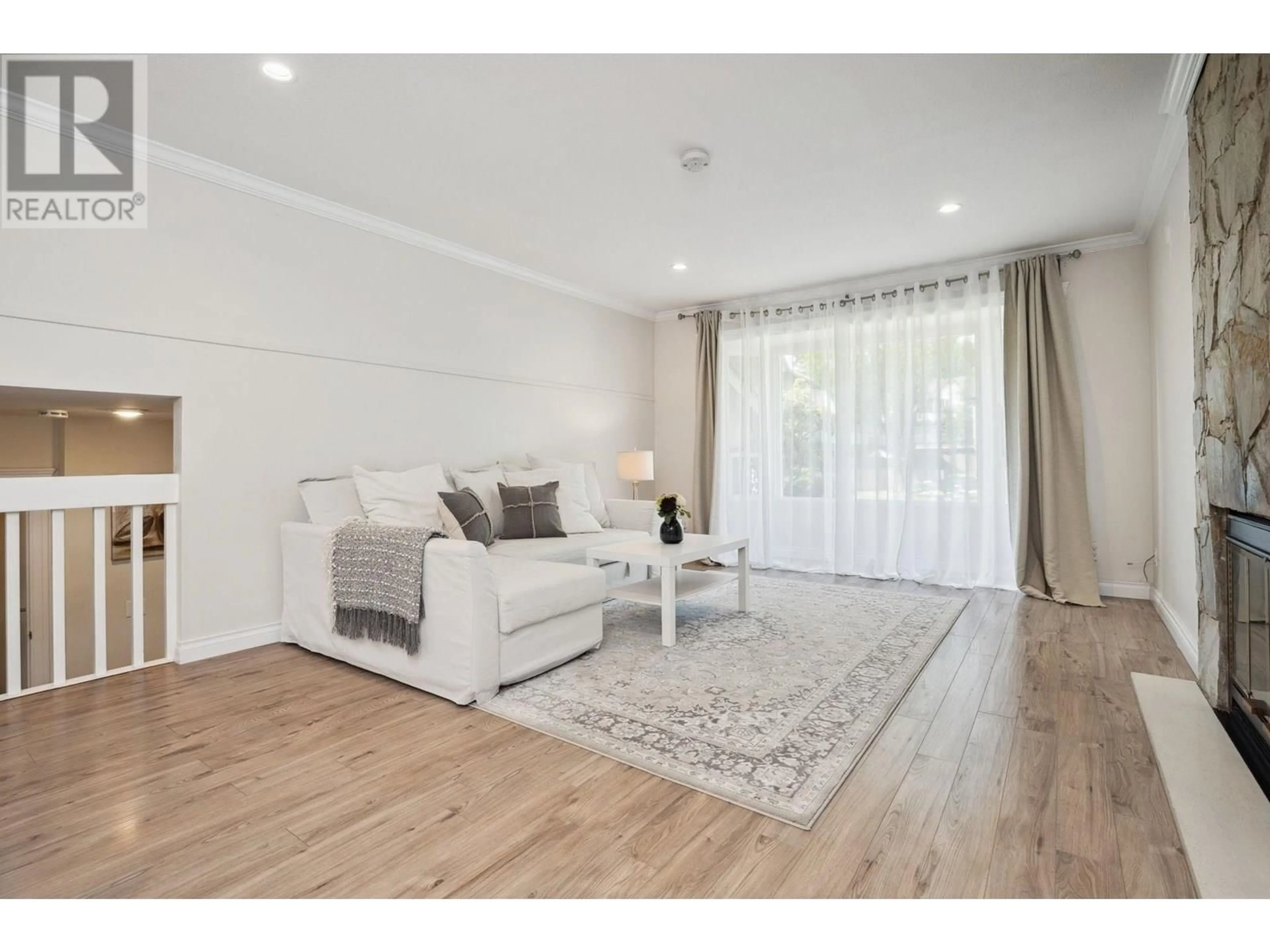 Living room with furniture, wood/laminate floor for 1163 FALCON DRIVE, Coquitlam British Columbia V3E2C2