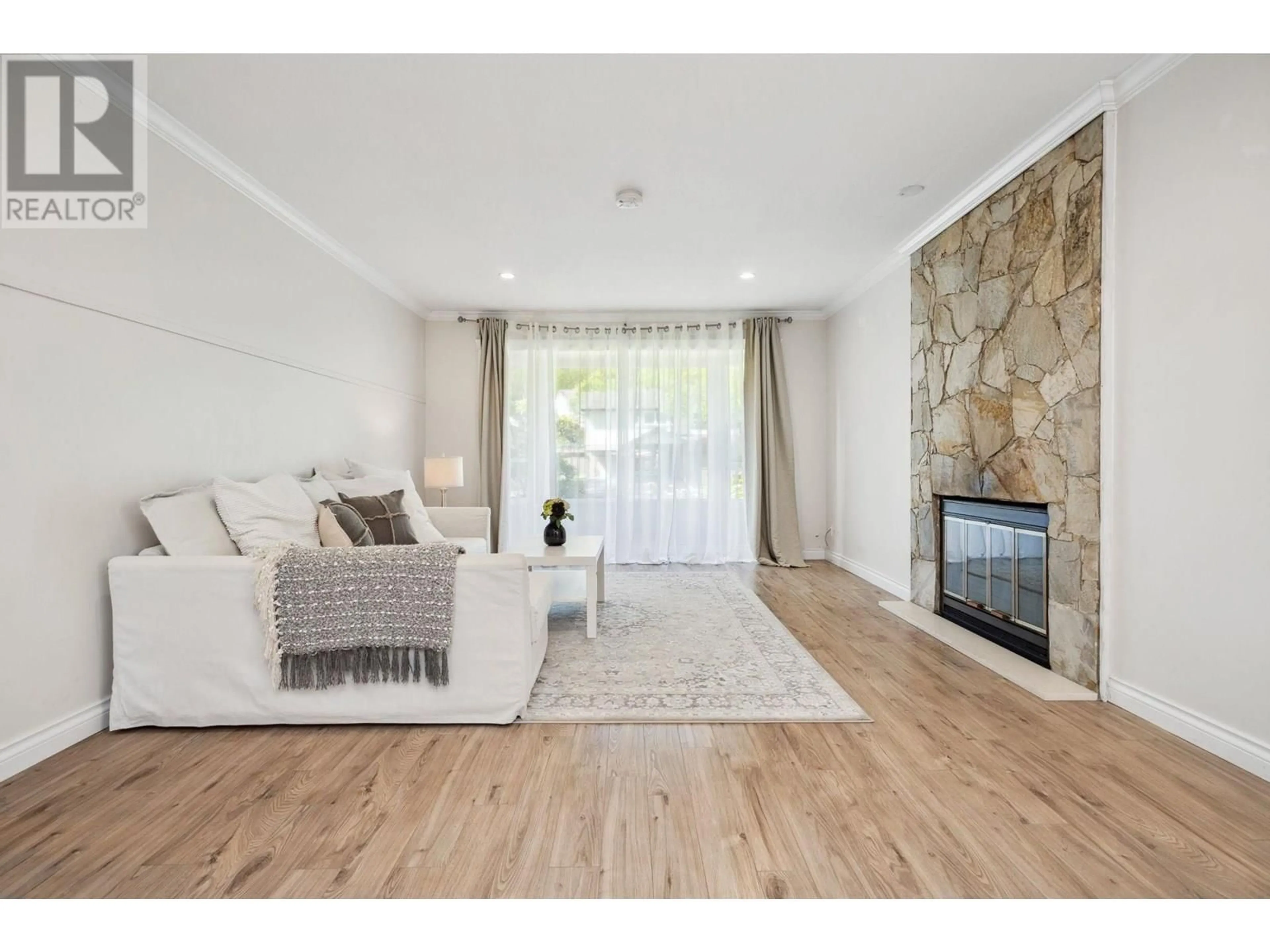Living room with furniture, wood/laminate floor for 1163 FALCON DRIVE, Coquitlam British Columbia V3E2C2