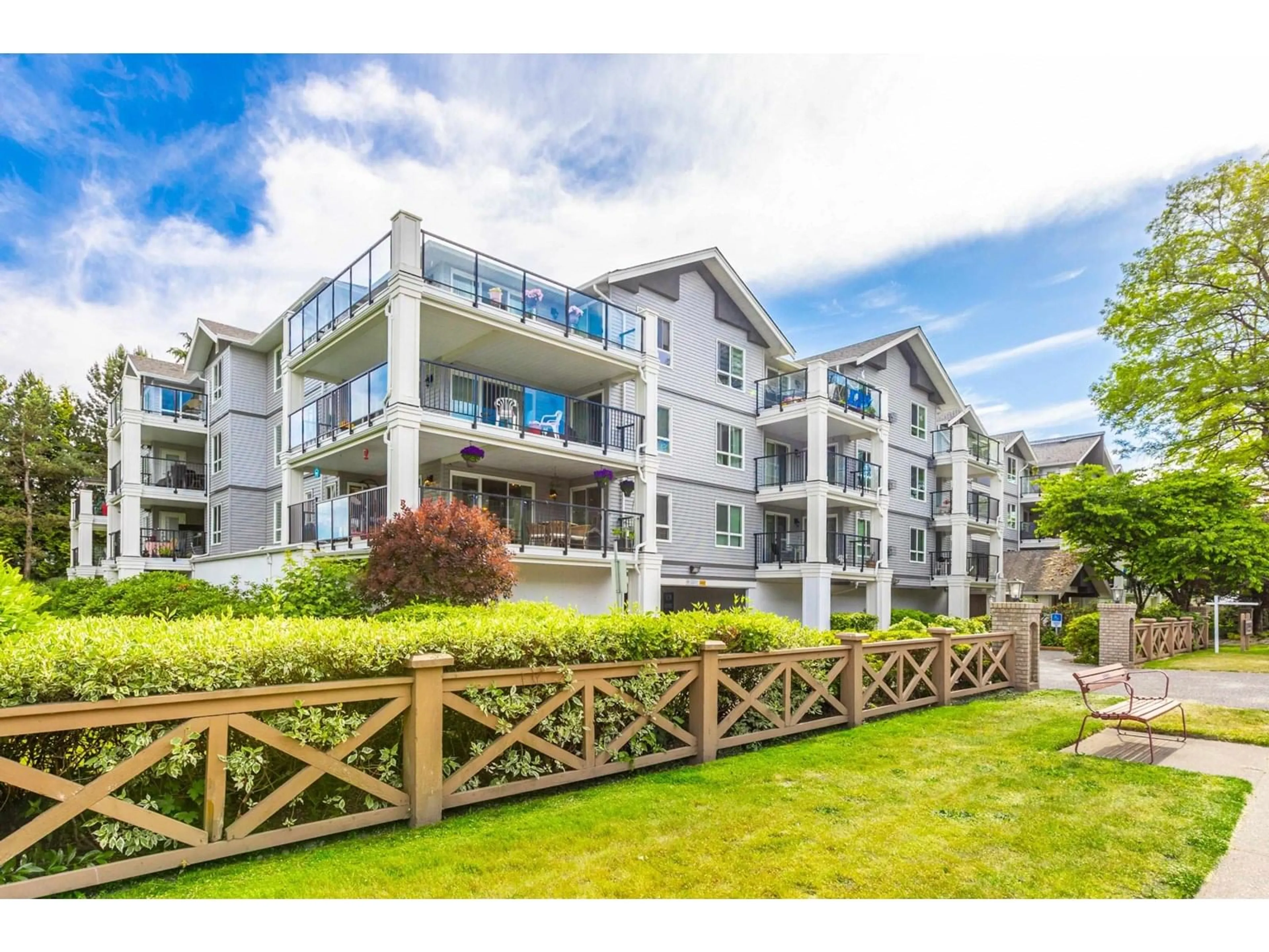 A pic from outside/outdoor area/front of a property/back of a property/a pic from drone, unknown for 103 - 20976 56, Langley British Columbia V3A7Z2